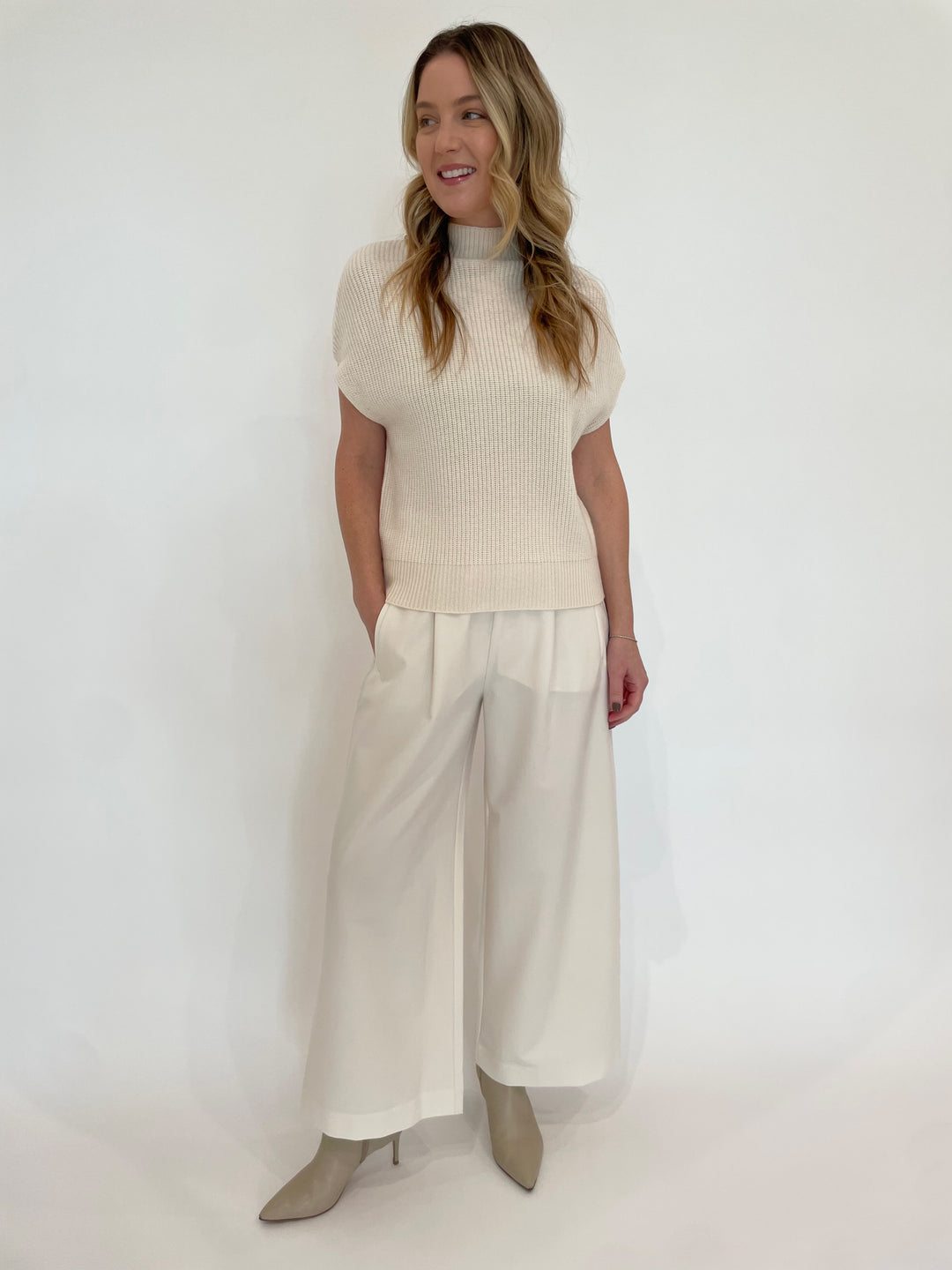 Lilla P. Ribbed Funnel Neck Short Sleeve Sweater in Ivory paired with Lilla P. Wide Leg Pull-On Pants in Winter White available at Barbara Katz