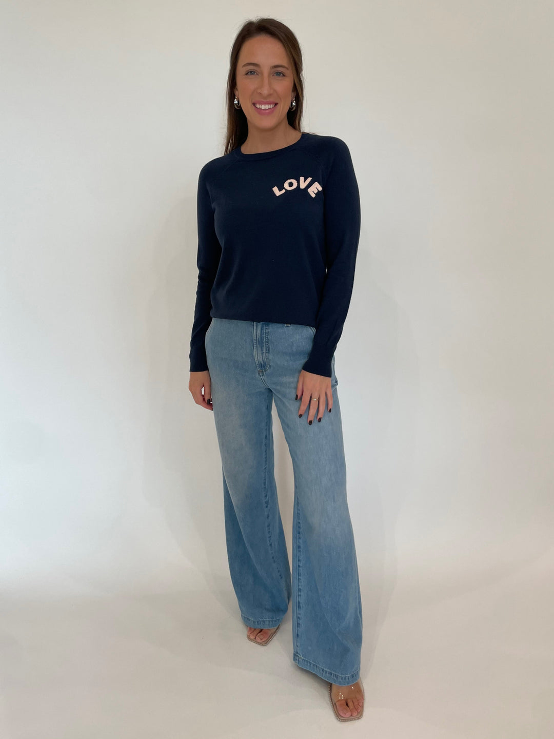 J Society Marsha Love Crew Sweater in Navy paired with Pistola Denim Dalia Wide Leg Jeans in Palo Alto, Lizzie Fortunato Organic Hoops in Silver/Clear available at Barbara Katz