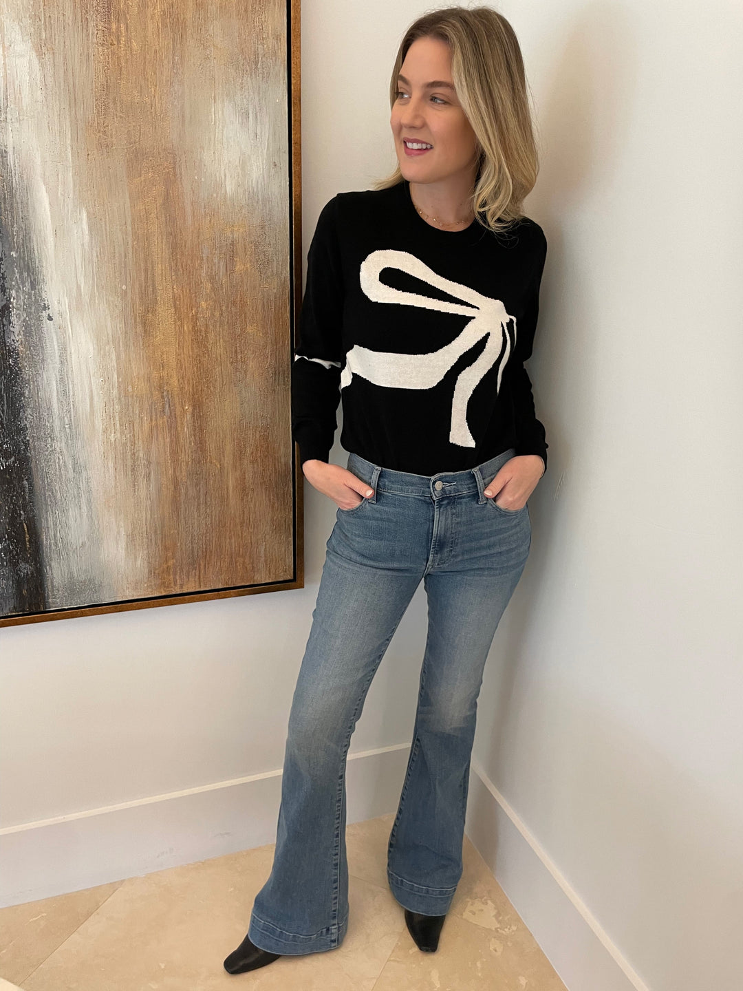 Zaket & Plover Angie Dress Me Up Pullover Sweater in Black paired with Pistola Denim Kinsley Ultra Flare Jeans in Essay available at Barbara Katz