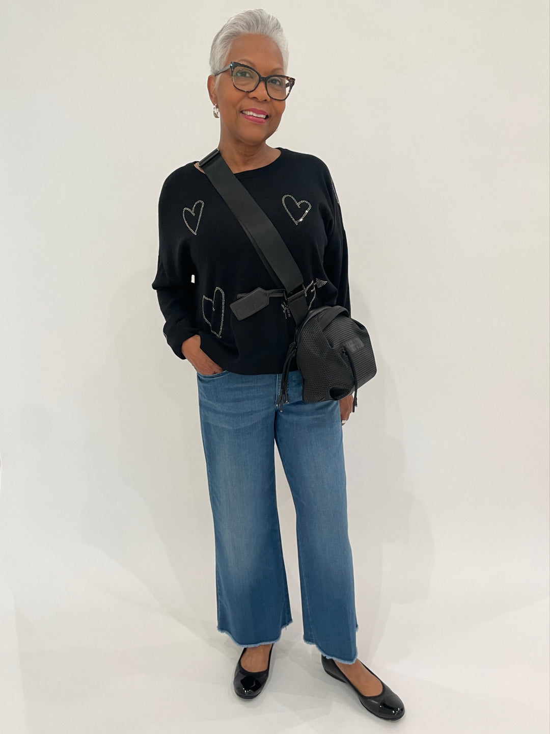 Whisper by Brodie Heart Hot Fix Long Sleeve Crew Sweater in Coal paired with Citizens of Humanity Lyra Crop Wide Leg Jeans in Bhodi, Lizzie Fortunato Clear Organic Hoop Earrings, Daniella Lehavi Black Bonnie Crossbody Bag available at Barbara Katz