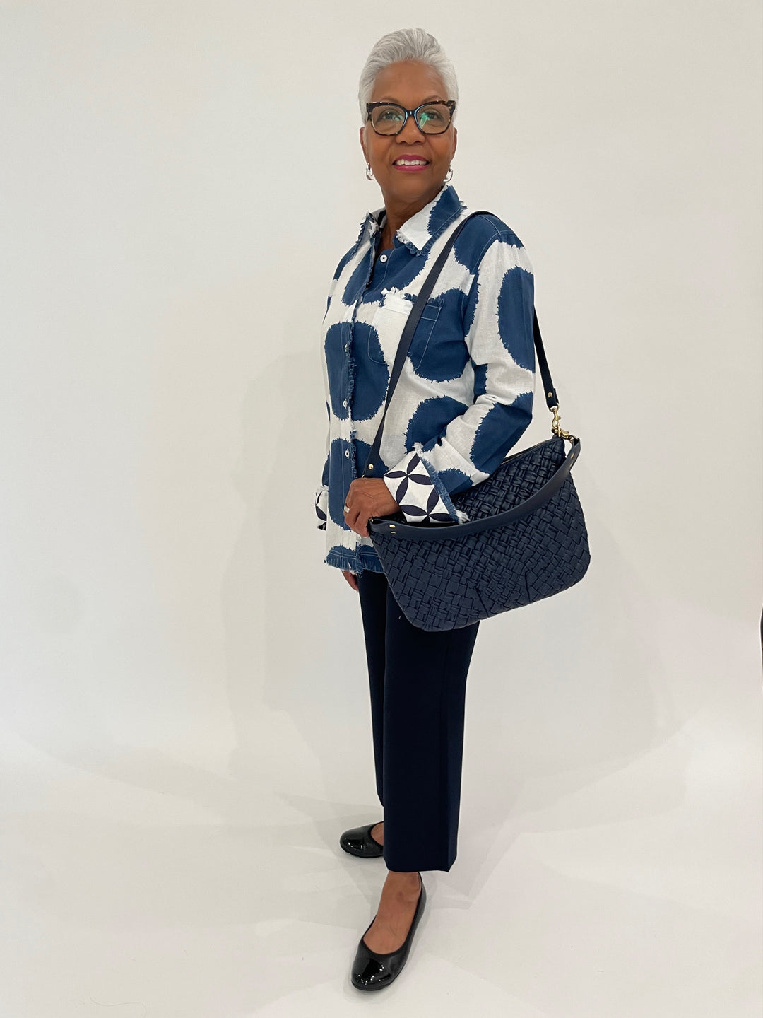 Dizzy-Lizzie Cape Cod Frayed Shirt in Big Navy Dots print paired with MAC Chiara Crop Floating Crepe Culottes Pants in Navy, Gabor Cap Toe Ballet Flat Shoes in Black, Clare V Moyen Messenger Bag in Navy Puff Woven available at Barbara Katz