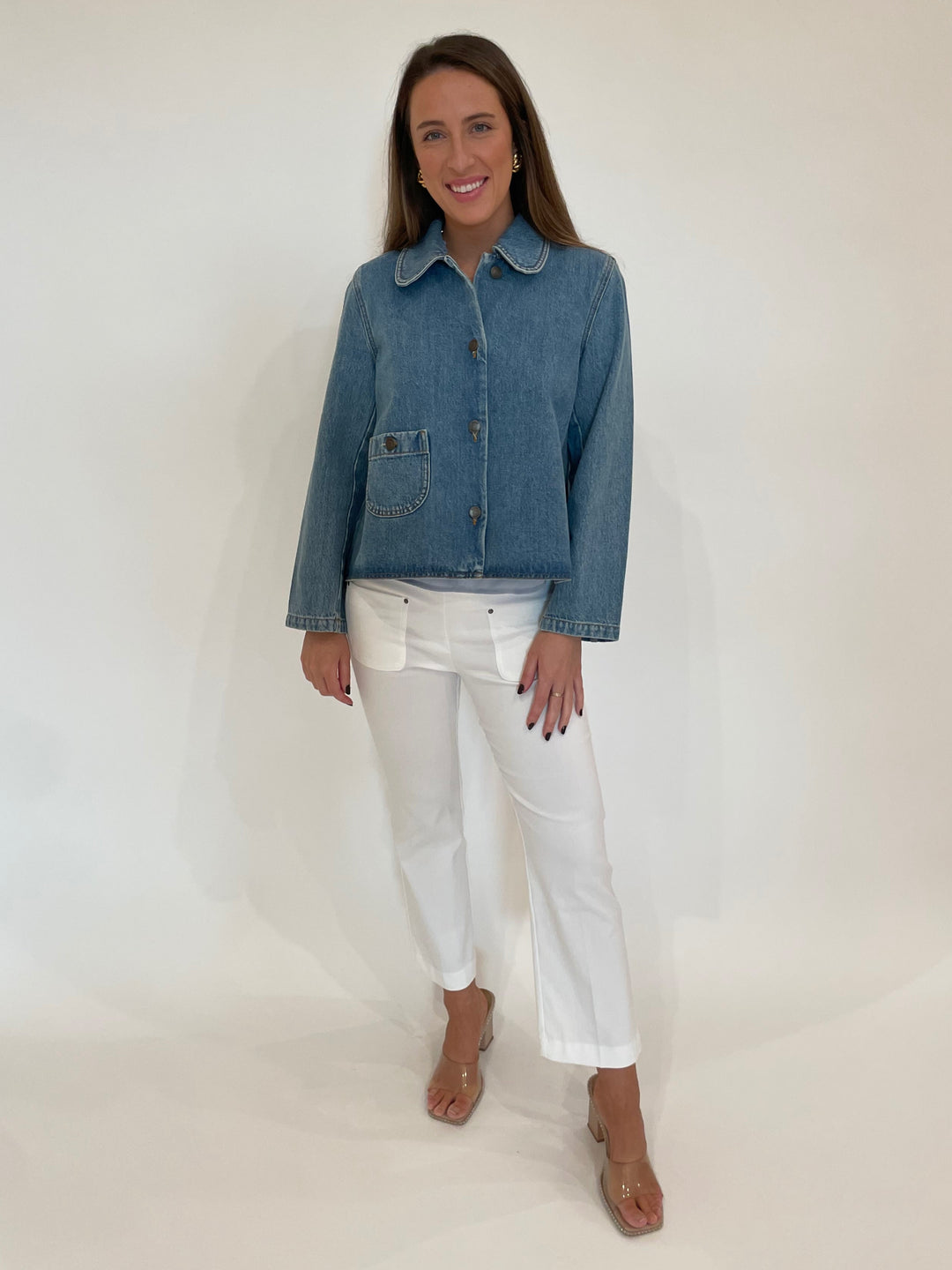 BA&SH Tiny Long Sleeve Denim Jacket in Blue paired with Elliott Lauren Baby Boot Pant With Patch Pocket in White, Ben-Amun Madeline Clip-On Earrings in Gold available at Barbara Katz