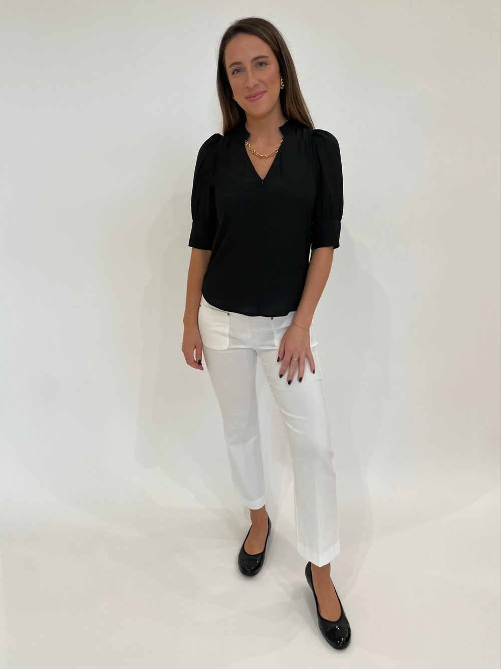 Lola & Sophie Miro Zip Front Blouse in Black paired with Elliott Lauren Baby Boot Pants in White, Lizzie Fortunato Mood Necklace in Gold, Ben-Amun Madeline Clip-On Link Earrings in Gold available at Barbara Katz