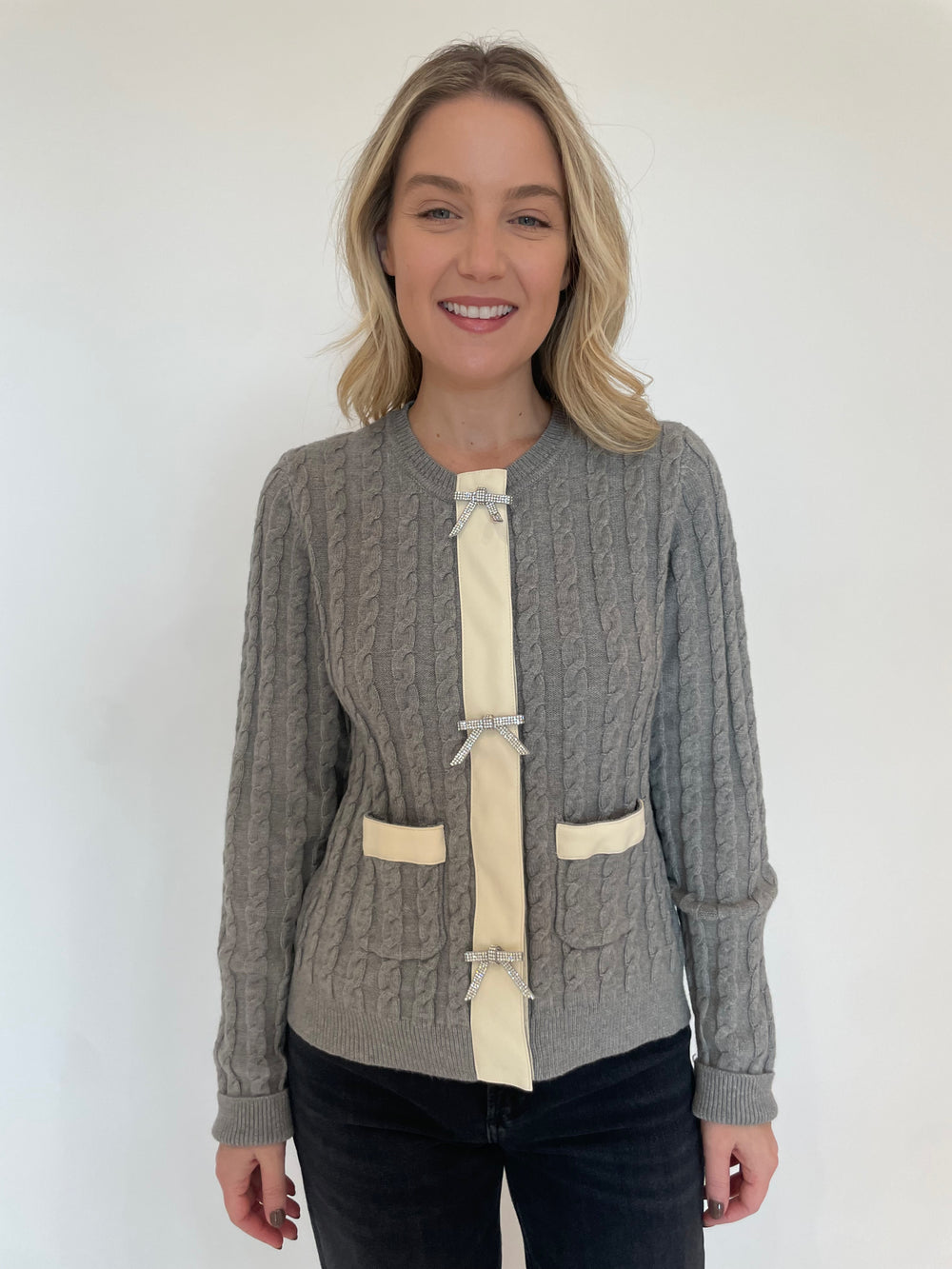 BK Tina Rhinestone Bow Cable Knit Cardigan in Gray available at Barbara Katz