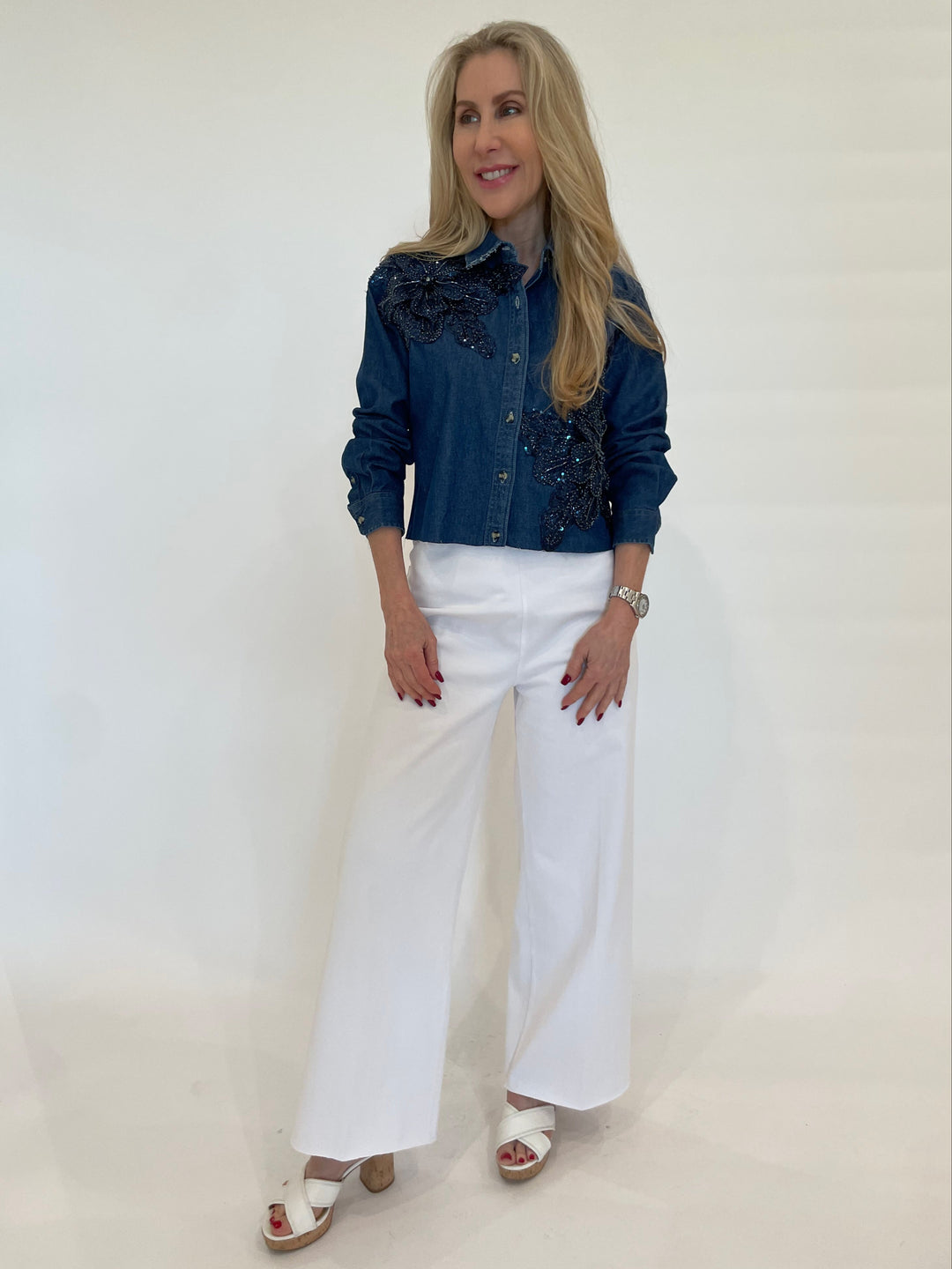 Suzy T Levine Crop Denim Top With Beaded Flower paired with Lysse Erin Wide Leg Pants in White available at Barbara Katz