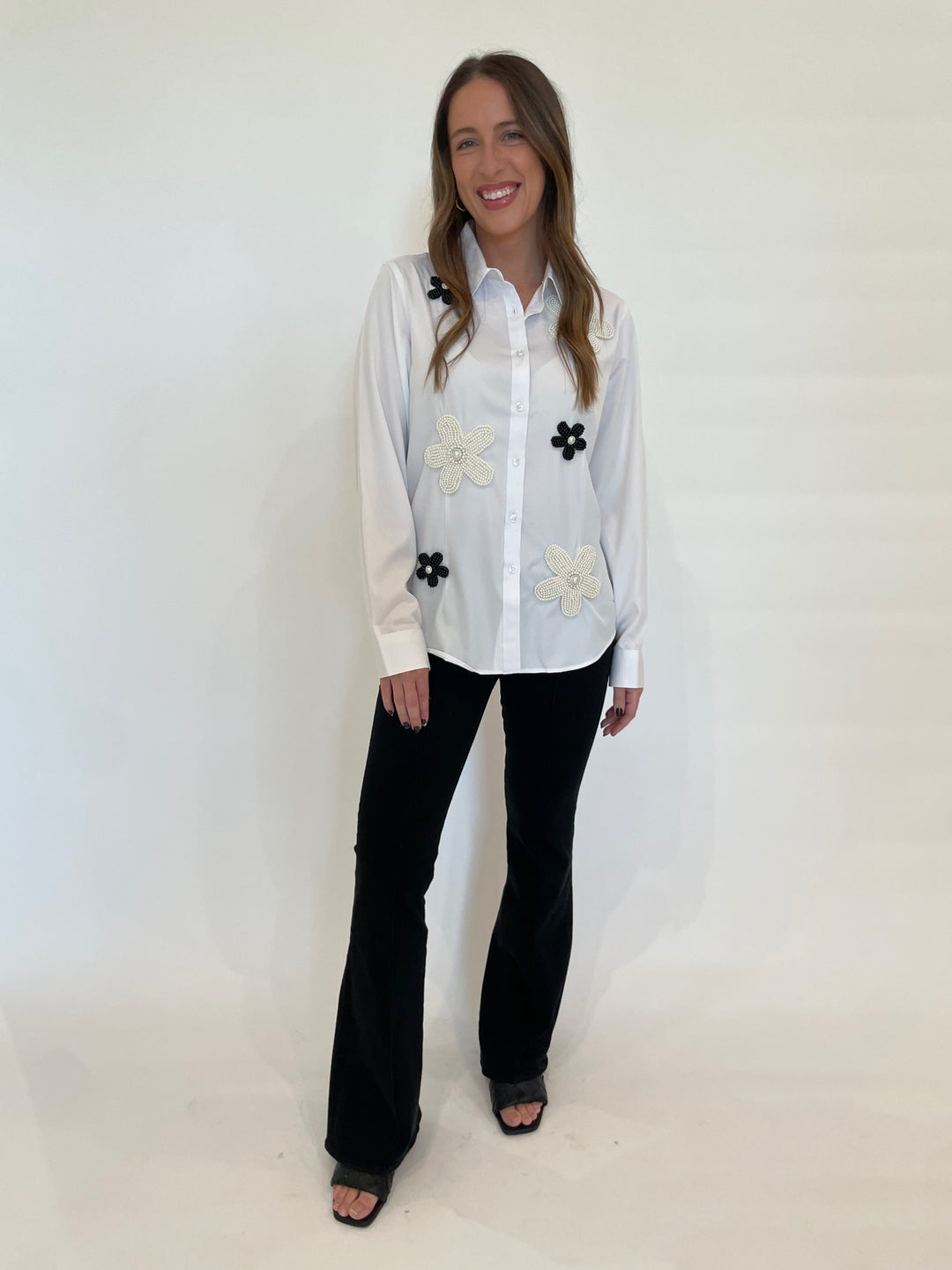 Suzy T Lau Beaded Flower Shirt in White paired with Frame Jetset Flare Pintuck Denim in Black  available at Barbara Katz