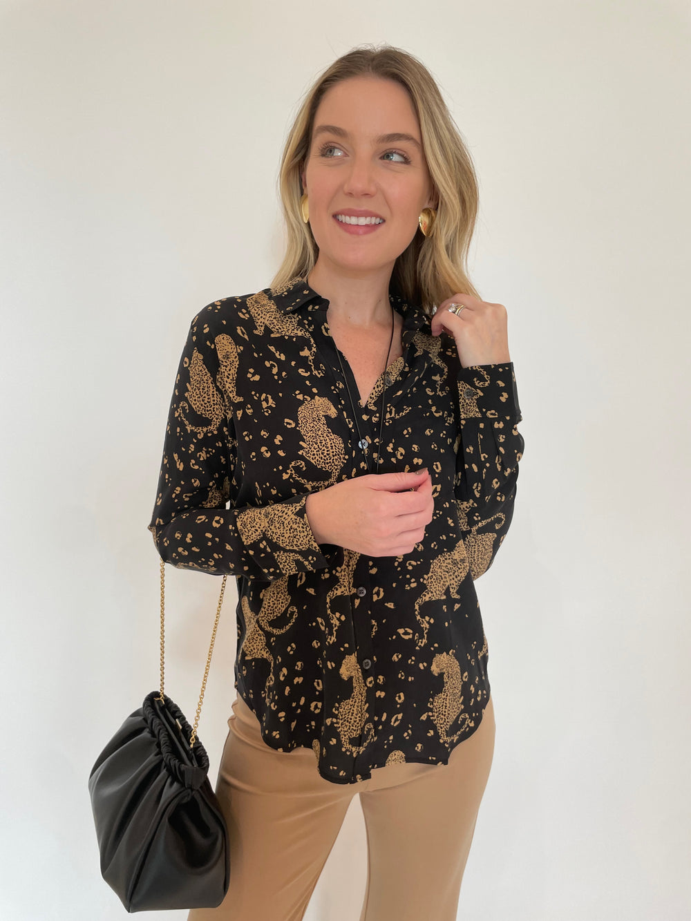 Rails Kate Button-Down Shirt in Noir Leopard print paired with Peace of Cloth Jules Paramount Trousers in Cork, Dean Davidson Crosby Long Pendant Necklace in Gold, Ben Amun Gold Triangle Smooth Clip Earrings - all available at Barbara Katz