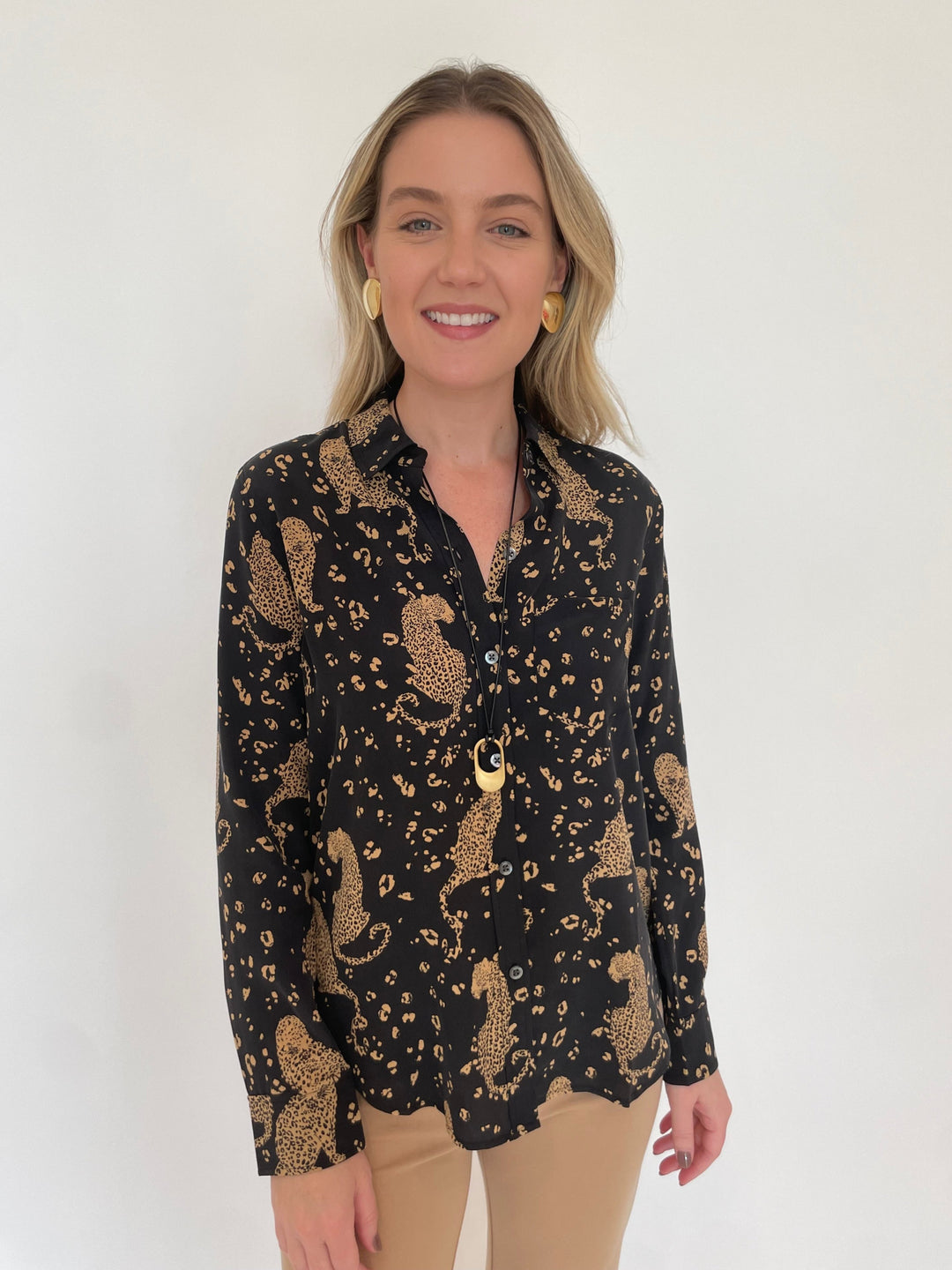 Rails Kate Button-Down Shirt in Noir Leopard print paired with Peace of Cloth Jules Paramount Trousers in Cork, Dean Davidson Crosby Long Pendant Necklace in Gold, Ben Amun Gold Triangle Smooth Clip Earrings - available at Barbara Katz