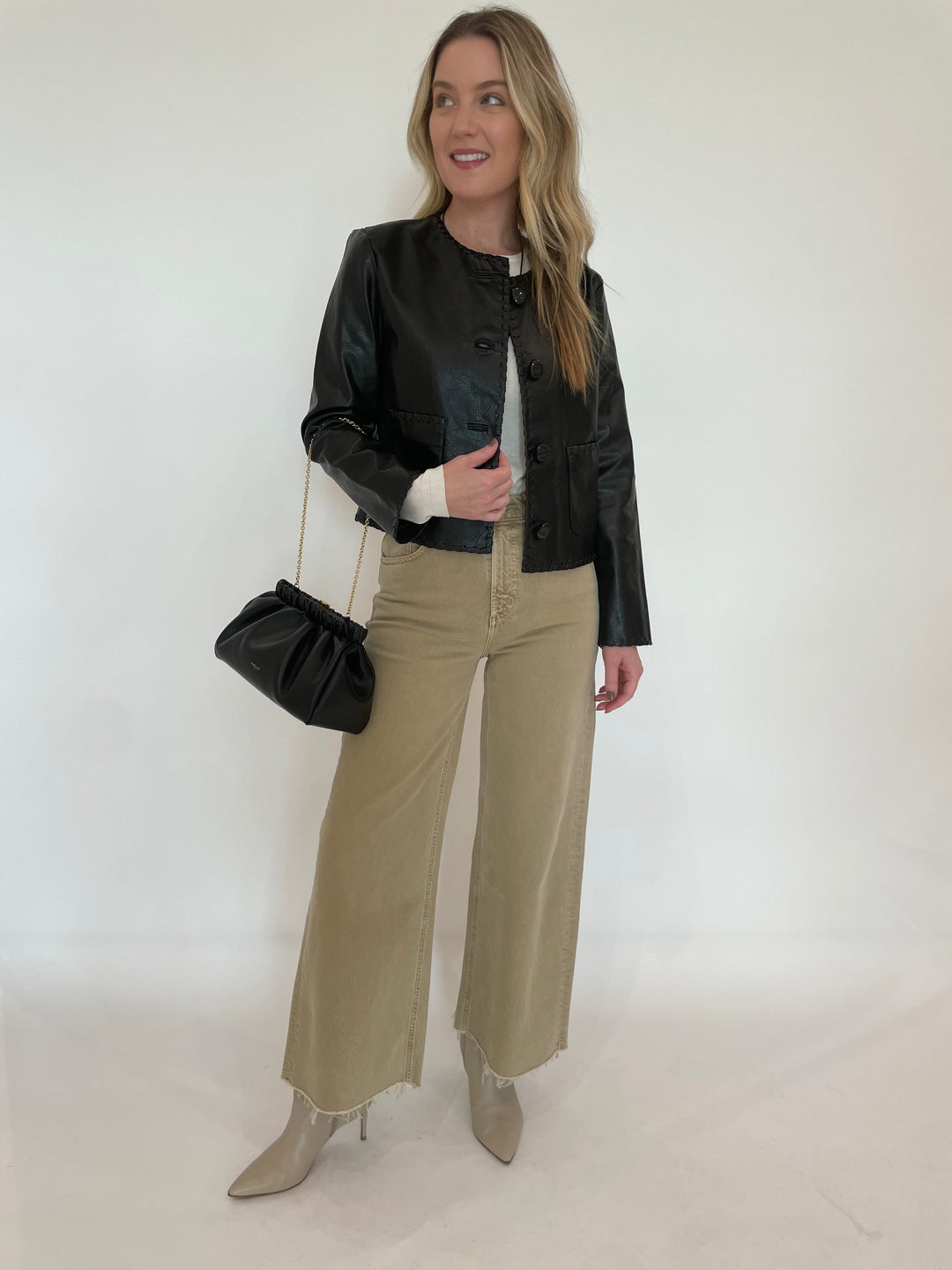 Cinq a Sept Nevina Jacket in Black paired with Citizens of humanity Lyra Crop Wide Leg Jeans in Porcini and DeMellier Miami Clutch in Black available at Barbara Katz