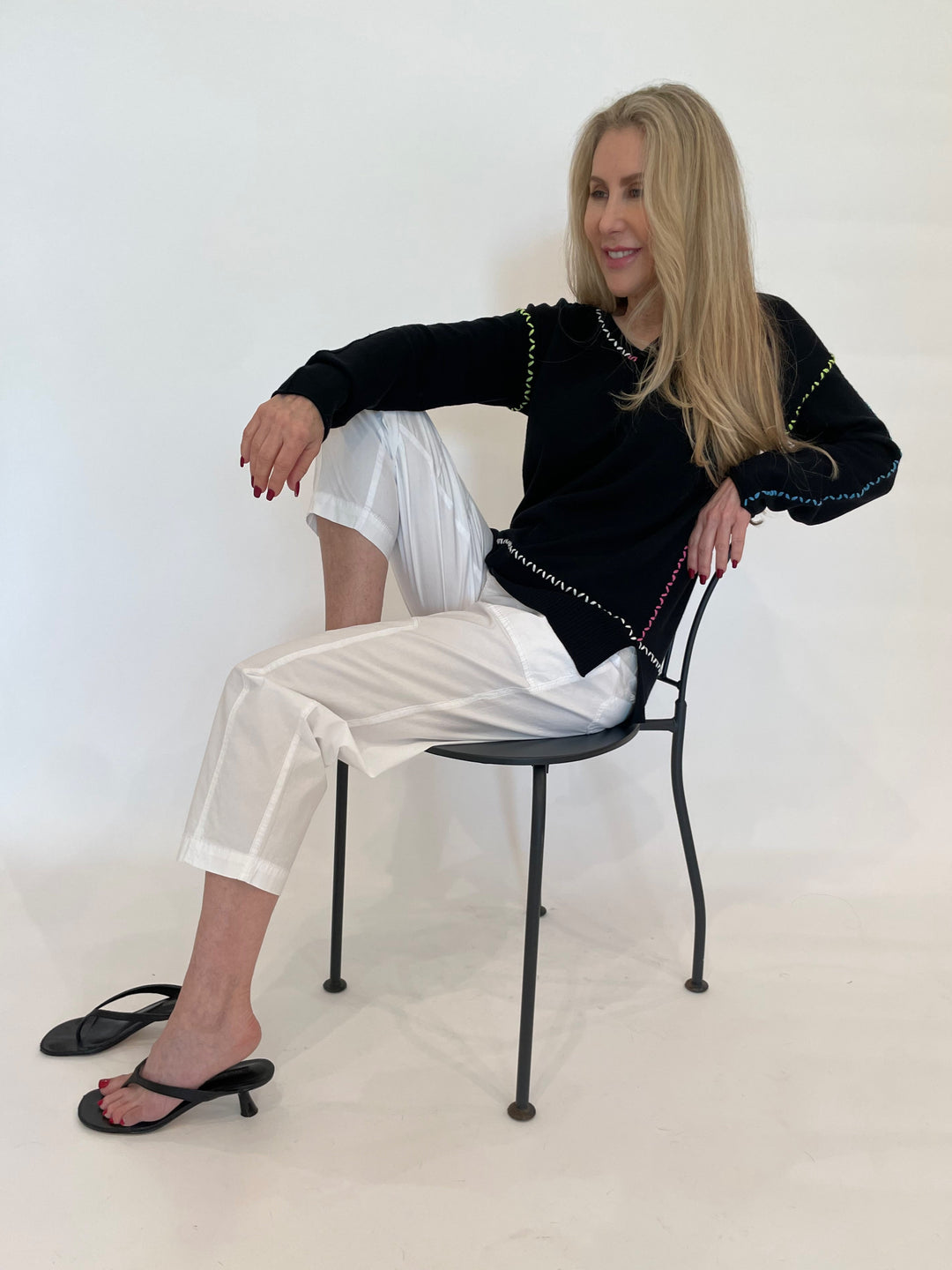 Pure Amici Mona Stitch V-Neck Sweater in Black paired with Marrakech Azure Pants in White available at Barbara Katz