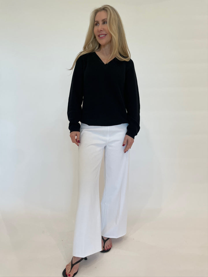 Pure Amici Myrna V-Neck Shaker Knit Sweater in Black paired with Lysse Erin Hi-Waist Wide Leg Denim in White available at Barbara Katz