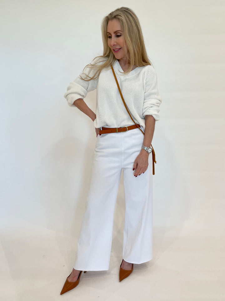 Pure Amici Myrna V-Neck Shaker Knit Sweater in White paired with Lysse Erin Hi-Waist Wide Leg Denim in White available at Barbara Katz