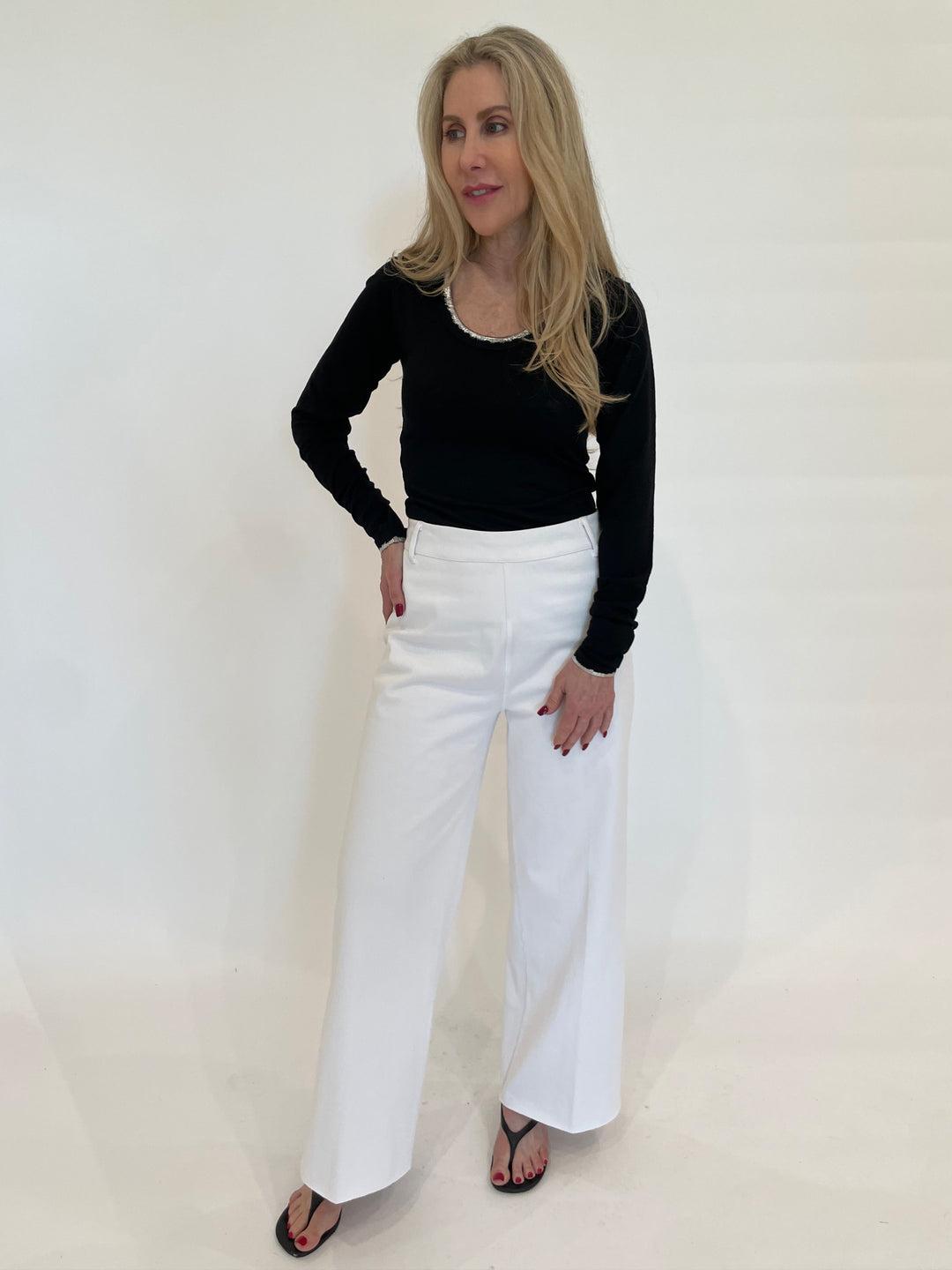 BK Kimmi Metallic Tipped Top in Black paired with Lysse Erin Hi-Waist Wide Leg Denim in White available at Barbara Katz