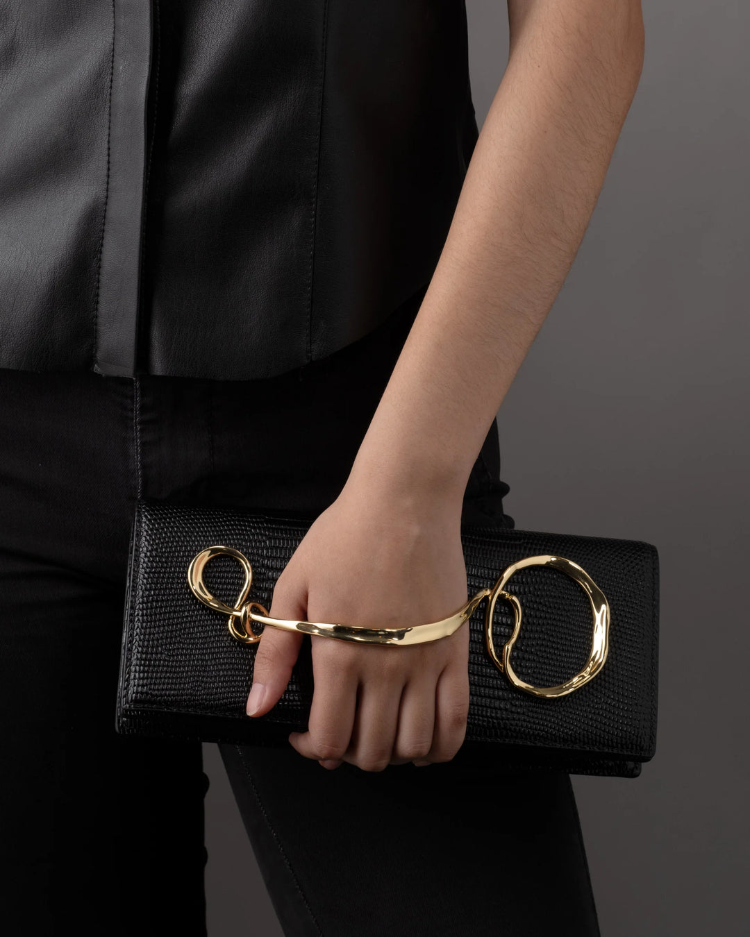 Alexis Bittar Twisted Gold Side Handle Leather Clutch Purse in Black available at Barbara Katz