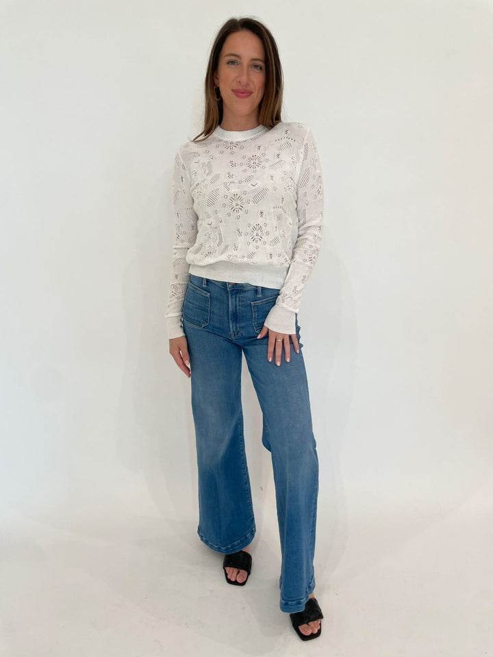 Autumn Cashmere Kayla Pointelle Fancy Stitch Crew Sweater in White paired with Mother Denim The Lil Hustler Roller Patch Pocket Sneak Jeans in Piece By Piece available at Barbara Katz