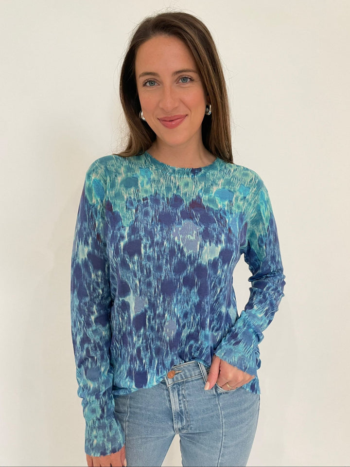 Autumn Cashmere Grace Gradient Botanic Print Distressed Crew Sweater in Blue Combo with Lizzie Fortunato Silver Onda Hoop Earrings available at Barbara Katz