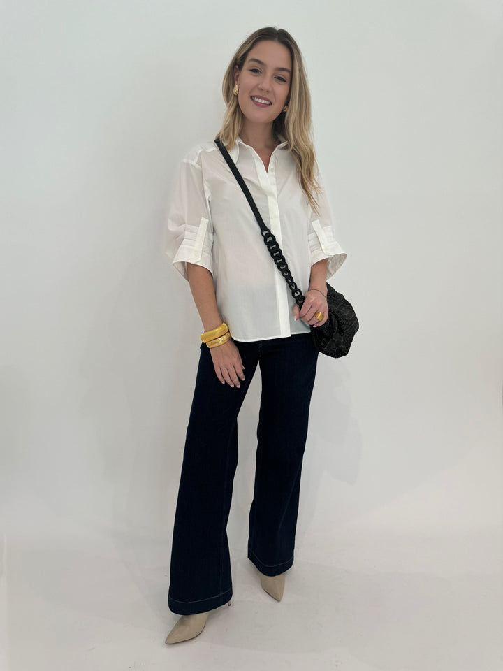 Simkhai Gemma Three-Quarter Sleeve Shirt in White paired with MAC Dream Wide Jeans 32" in Indigo Dark, Daniella Lehavi Tokyo Bali Bag and Barbara Katz Jewelry