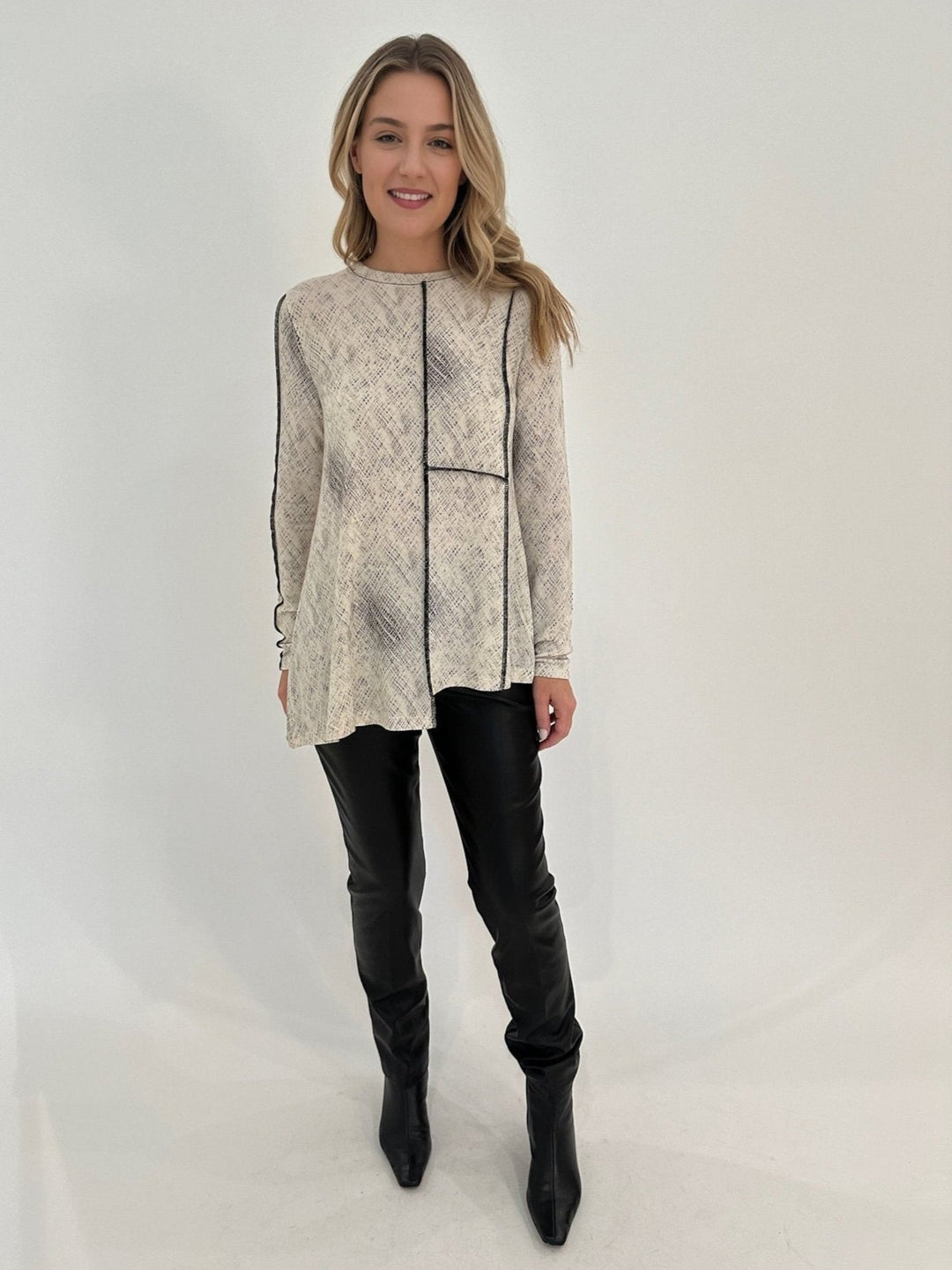 Ozai N Ku Mindy Dots Long Sleeve Asymmetrical Top paired with Peace of Cloth Black Faux Leather Slim Jeans available at Barbara Katz