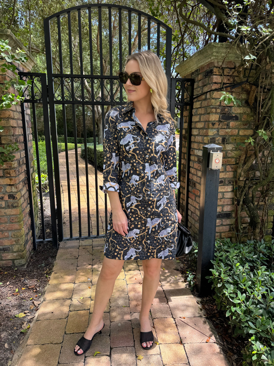 Dizzy-Lizzie Sag Harbor Shirt Dress in Black with Sleeping Cheetahs Print, shown with DeMellier Black Smooth Miami Clutch available at Barbara Katz