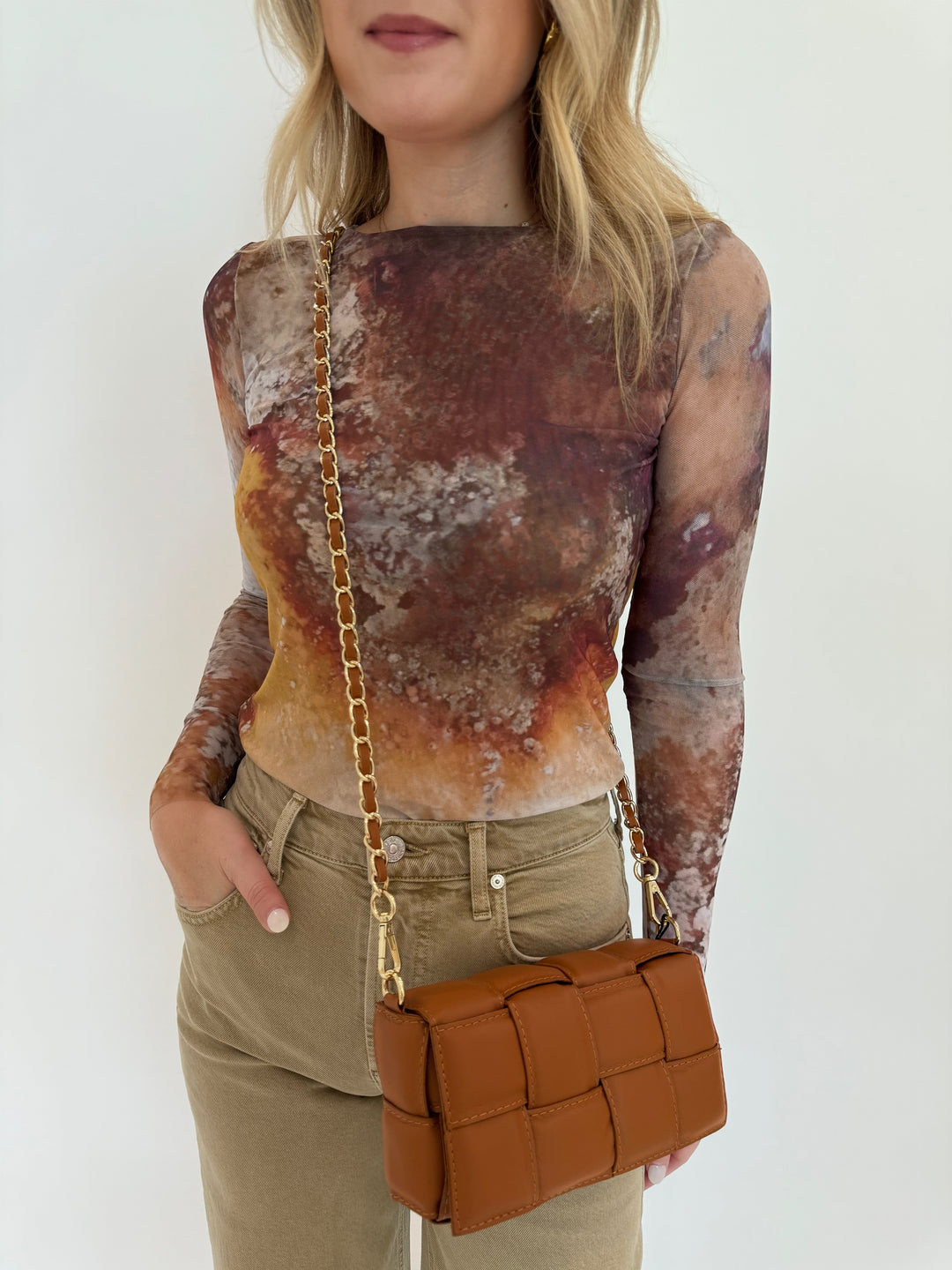 AMB Florence Double Sheer Top in Cavely paired with Citizens of Humanity Lyra Crop Wide Leg Jeans in Porcini, and BK Square Weave Leather Crossbody Bag in Camel, all available on BarbaraKatz.com