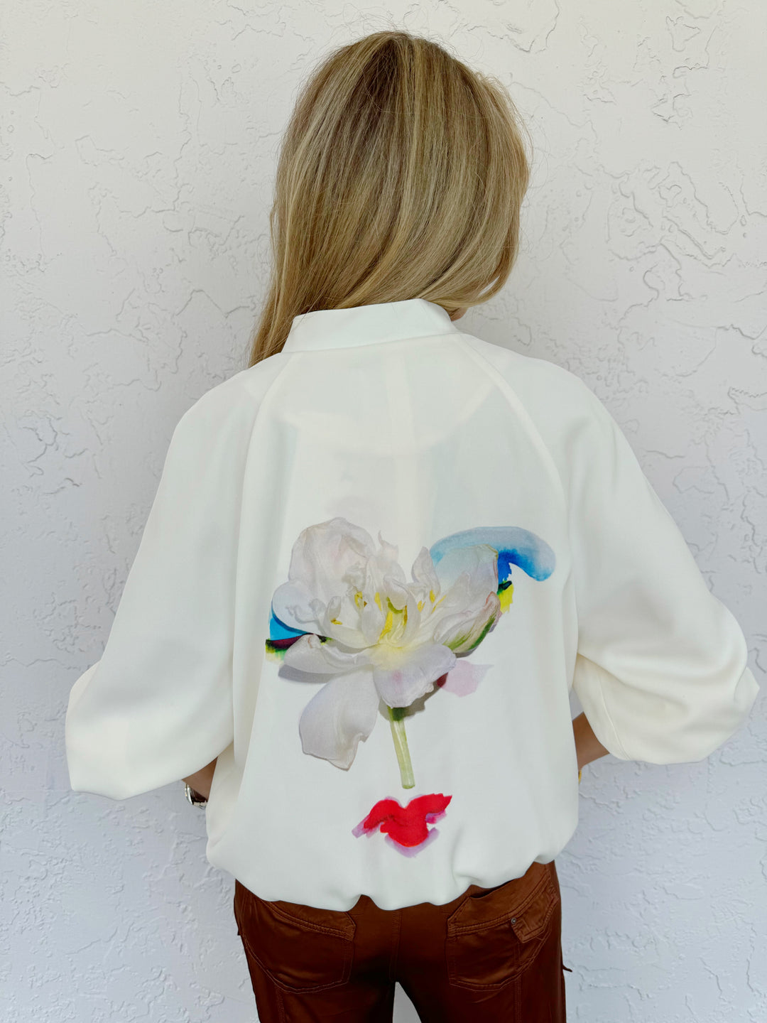 Marella Aligi Jacket in White, made from 100% polyester, featuring a rounded collar, zipper closure, long sleeves, side pockets, and floral print at the back