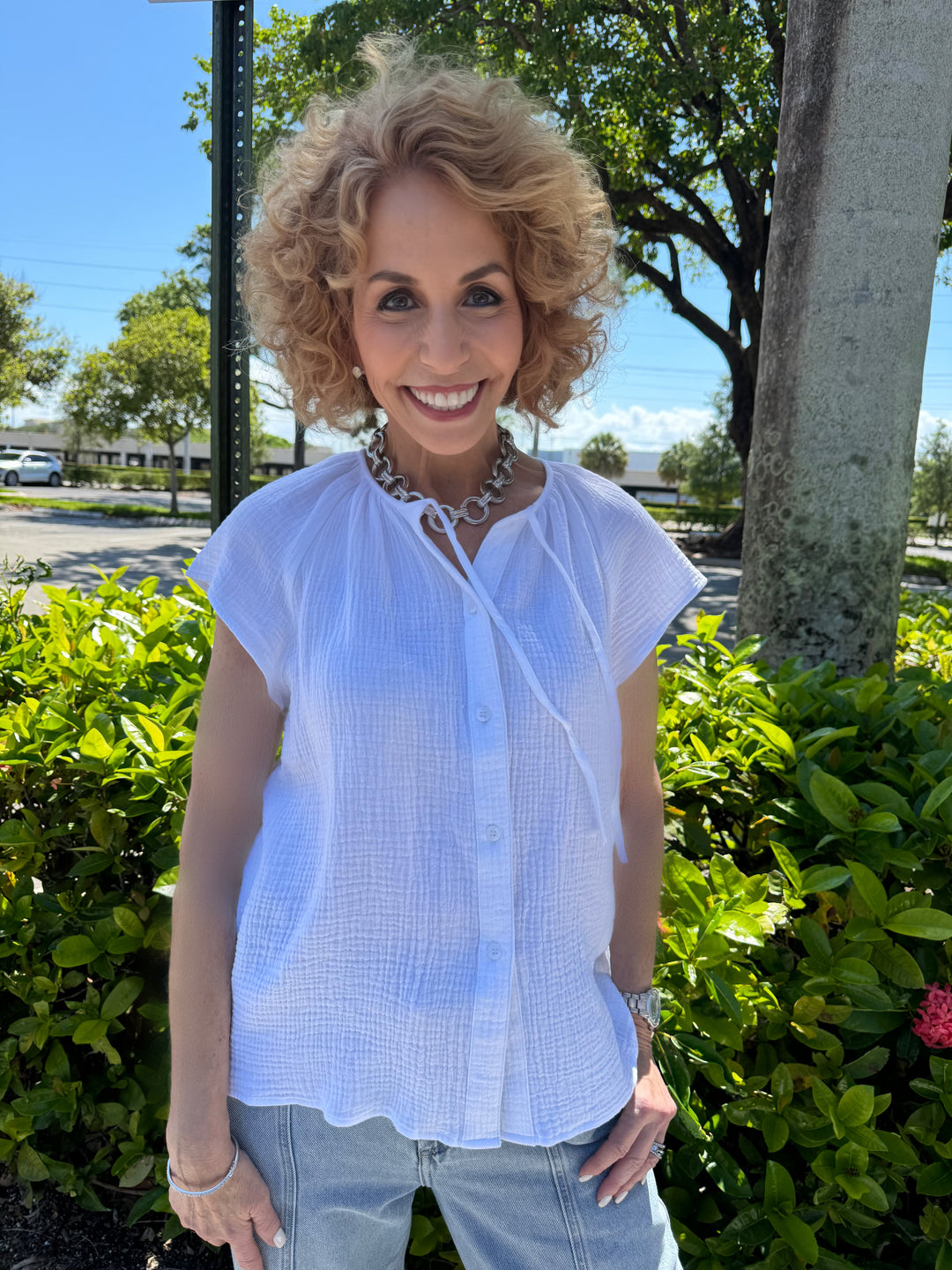 Barbara Katz Maxine Button Drawstring Top in Optic White, 100% cotton blouse with short sleeves, button front closure, and drawstring neck detail