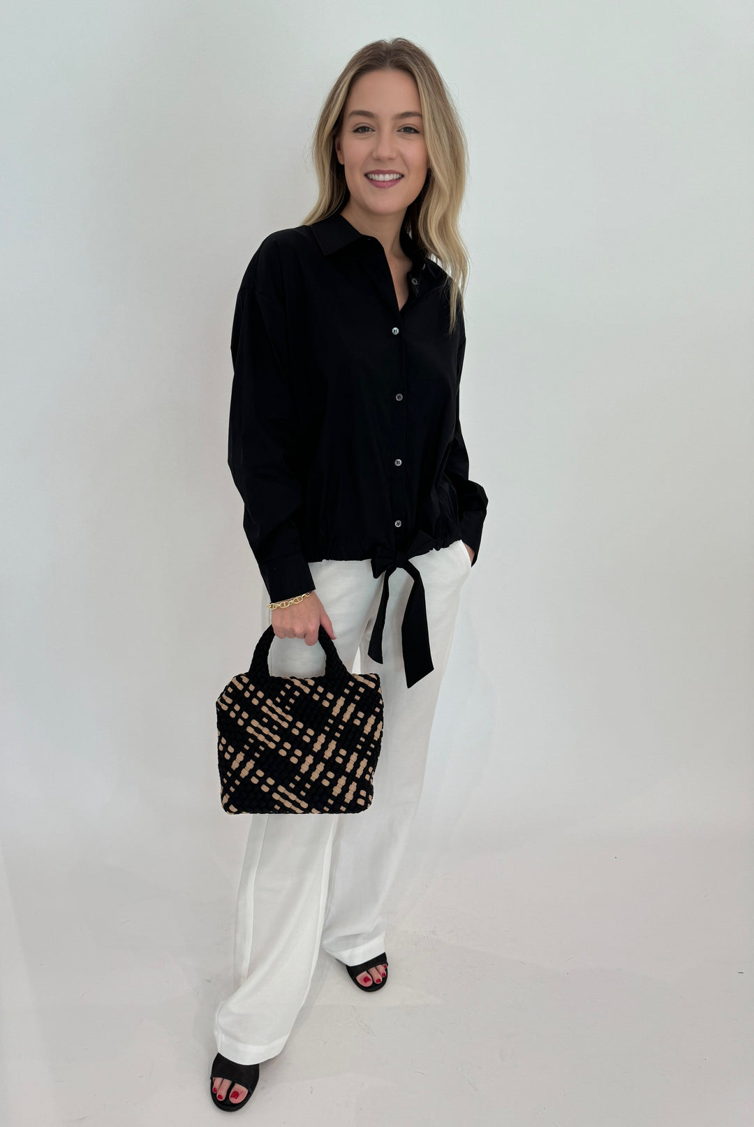 Repeat Tie Waistband Blouse in Black paired with Enza Costa Twill Everywhere Pant in Off White and Sol and Selene Sky's The Limit Small Bag in Black/Nude