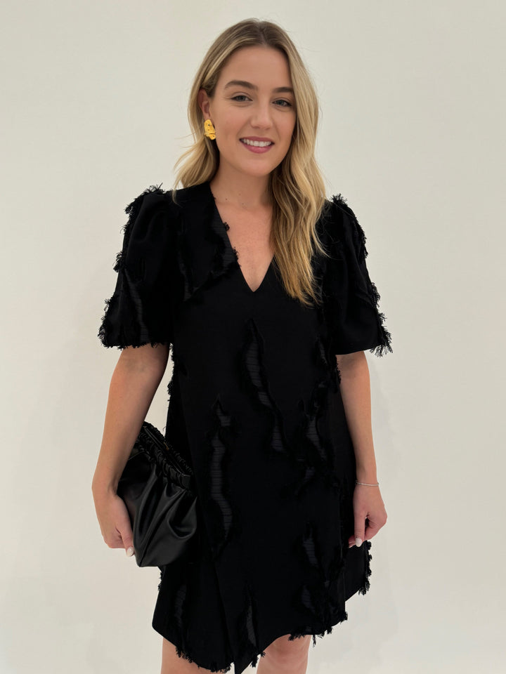 Stine Goya Black Puffy Sleeves Mini Dress with Mignonne Gavigan Christopher Gold Stud Earrings, and DeMellier Black Miami Clutch - all available at Barbara Katz