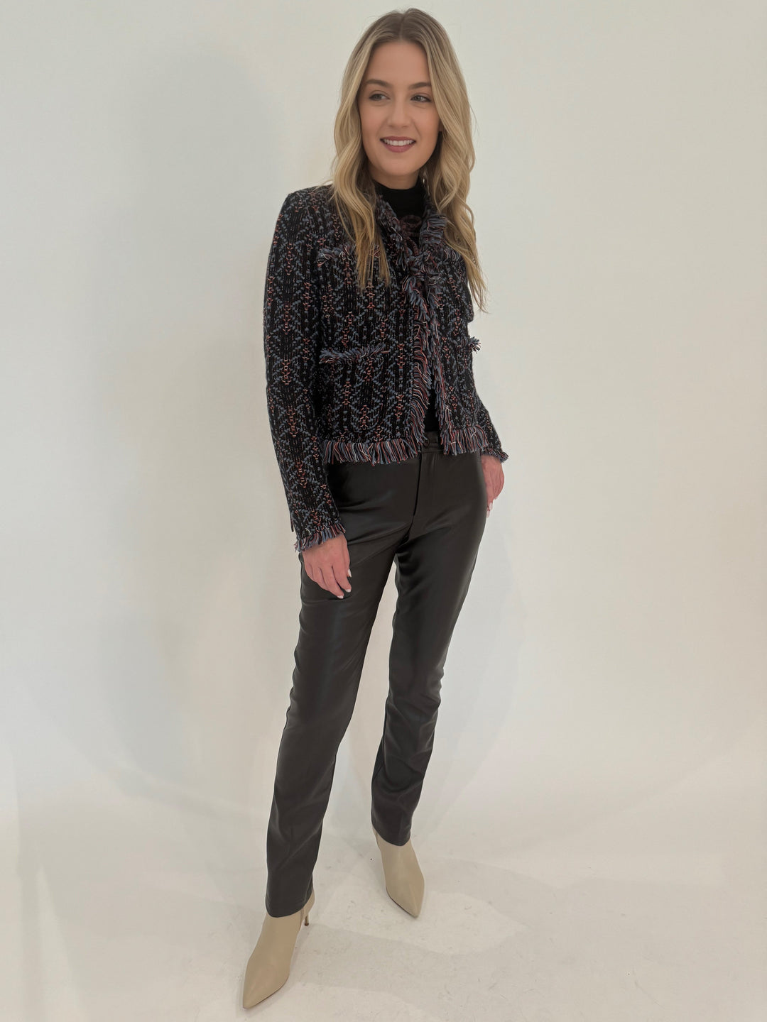 Peace of Cloth Jilian Faux Leather Slim Jeans in Black paired with Aldomartins Cook Boucle Fringe Jacket available at Barbara Katz