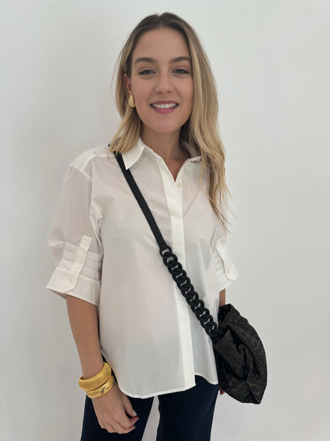 Simkhai Gemma Three-Quarter Sleeve Shirt in White with Daniella Lehavi Tokyo Bali Bag and Barbara Katz Jewelry 