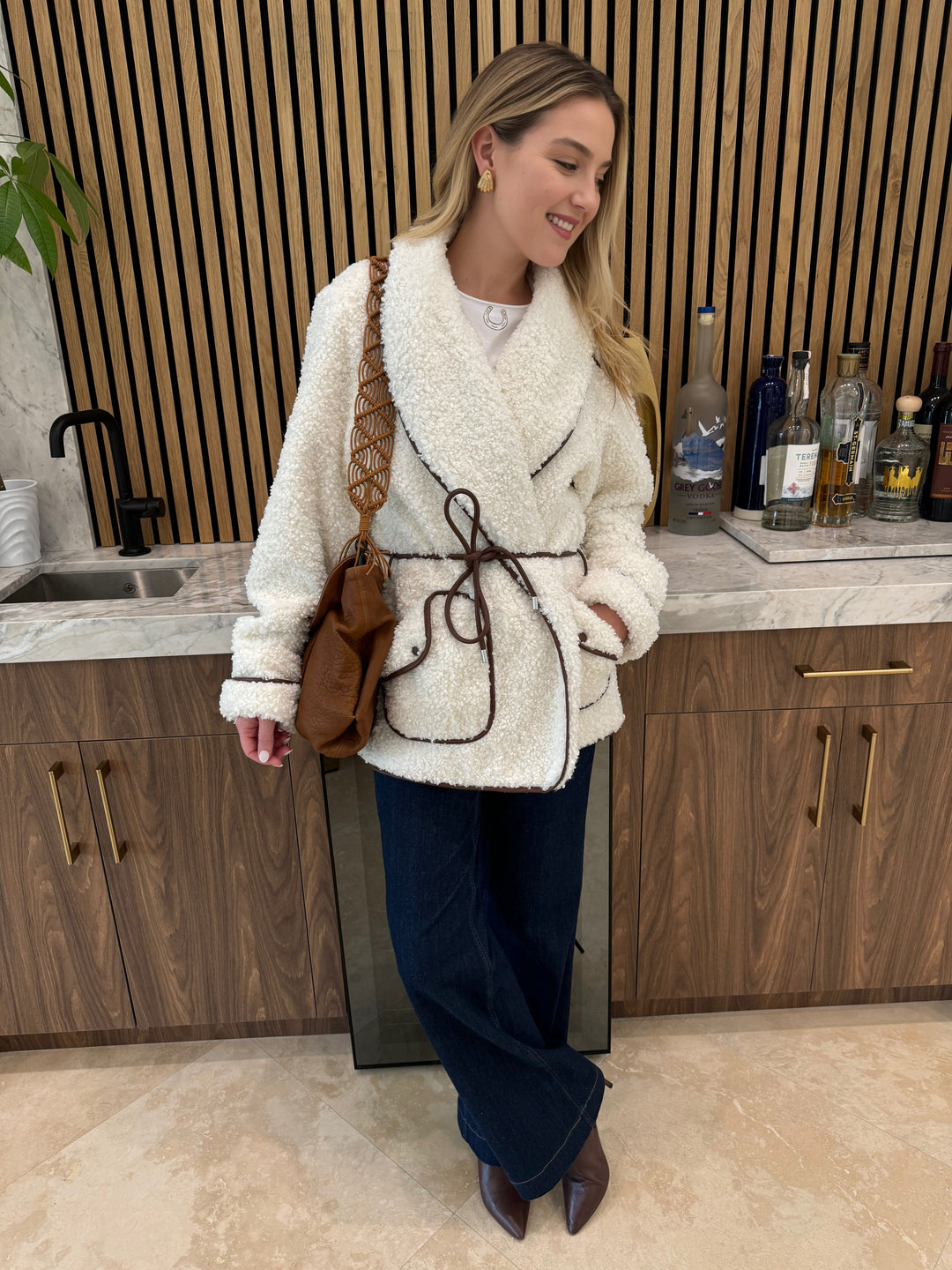 Catherine Gee Embroidered Horse Shoe Tee in White layered with Simkhai Kimia Tie Waist Jacket, paired with MAC Dream Wide Jeans 32" in Indigo Dark and Daniella Lehavi Miami Maxi Bag