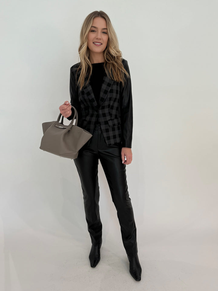 Peace of Cloth Jilian Faux Leather Slim Jeans in Black paired with Rowan Moto Jacket, bag DeMellier The Midi New York Tote in Stone Grey, all available at Barbara Katz