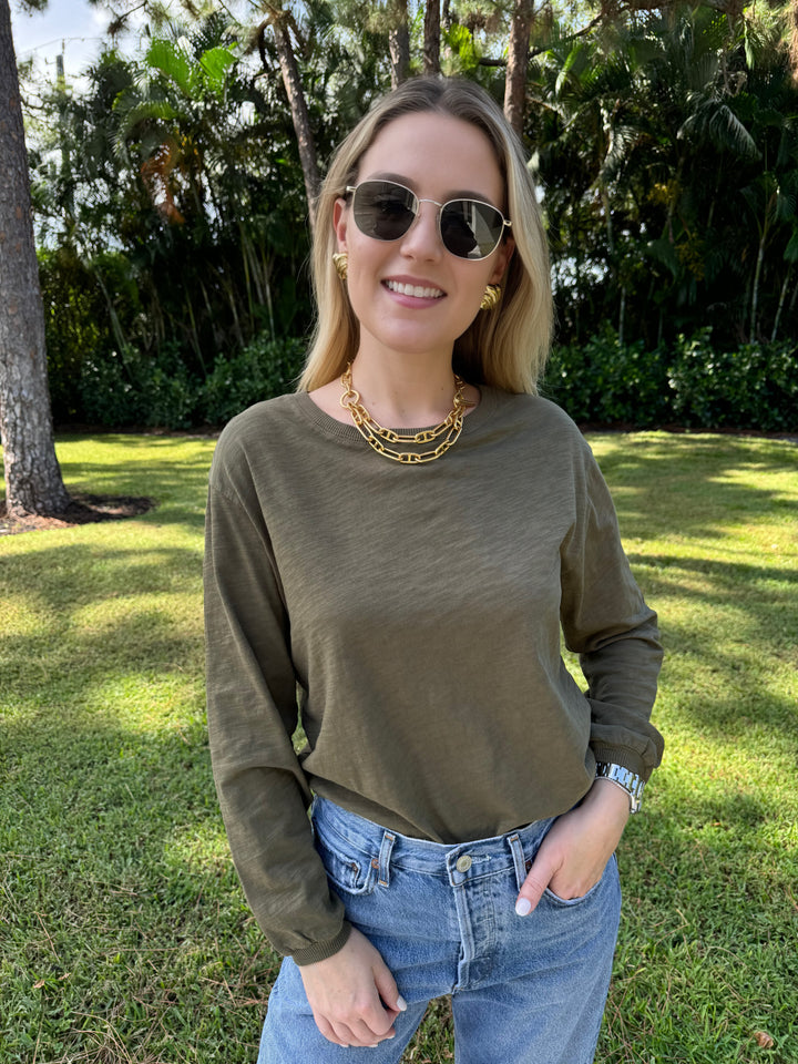 An olive green Elliott Lauren Balloon Sleeve Tee made of 100% cotton, with long sleeves, round neck, and ribbed trims. Perfect for casual wear. #elliottlauren #longsleeves #tee