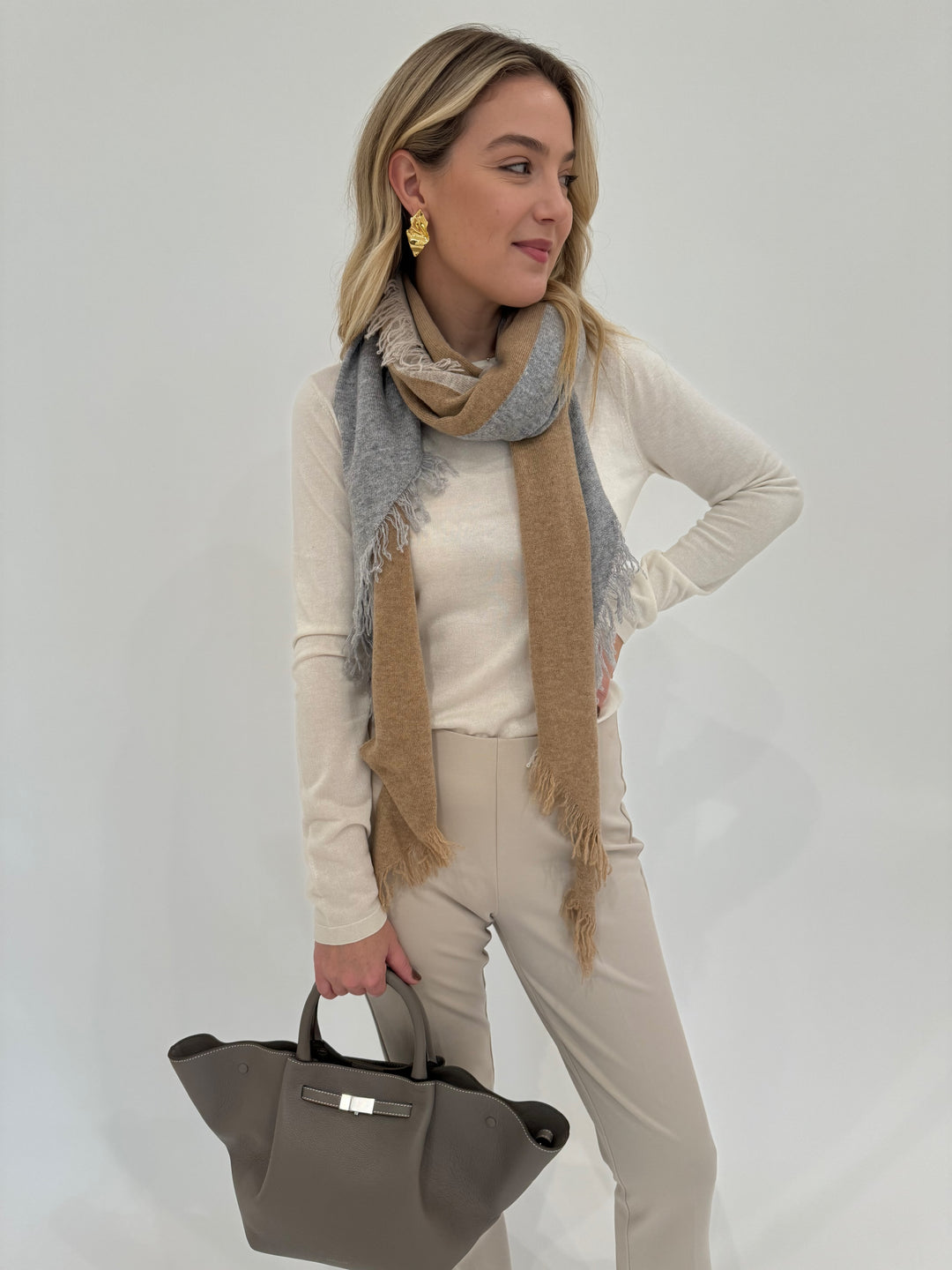 Kinross Cashmere Fitted Crew Sweater in Ivory paired with Peace of Cloth Annie Paramount Knit Pants in Buff available at Barbara Katz