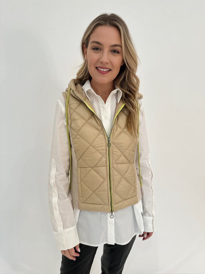 Aldomartins Ibon Hooded Vest in Vanilla with Ozai N Ku Camille White Button Detail Shirt underneath available at Barbara Katz