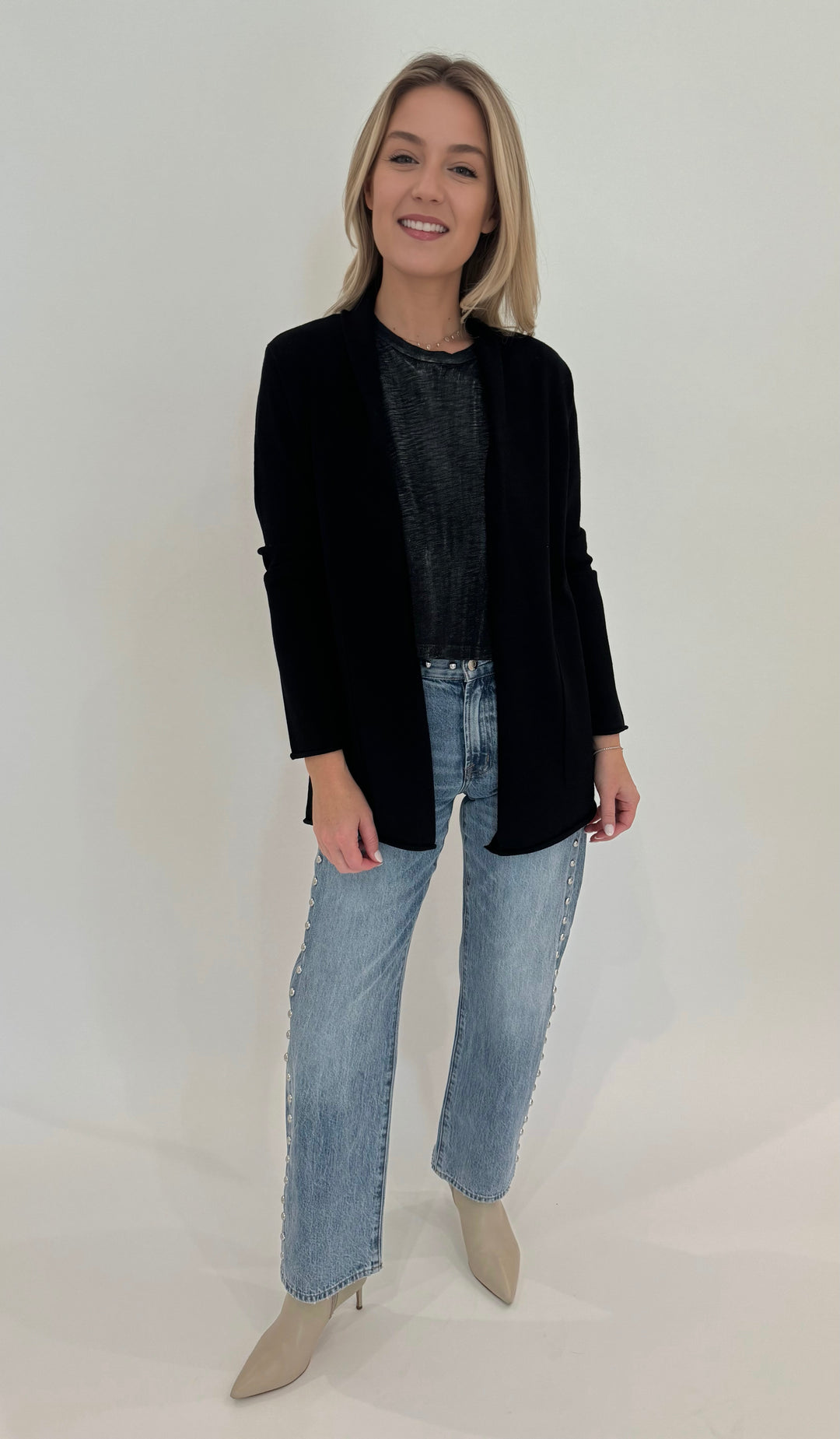 BK Olivia Long Open Cardigan in Black with Goldie Metallic Sparkle Crop Tee in Black/Silver underneath, paired with Pistola Lexi Mid Rise Bowed Straight Jeans in Satellite, all available at Barbara Katz