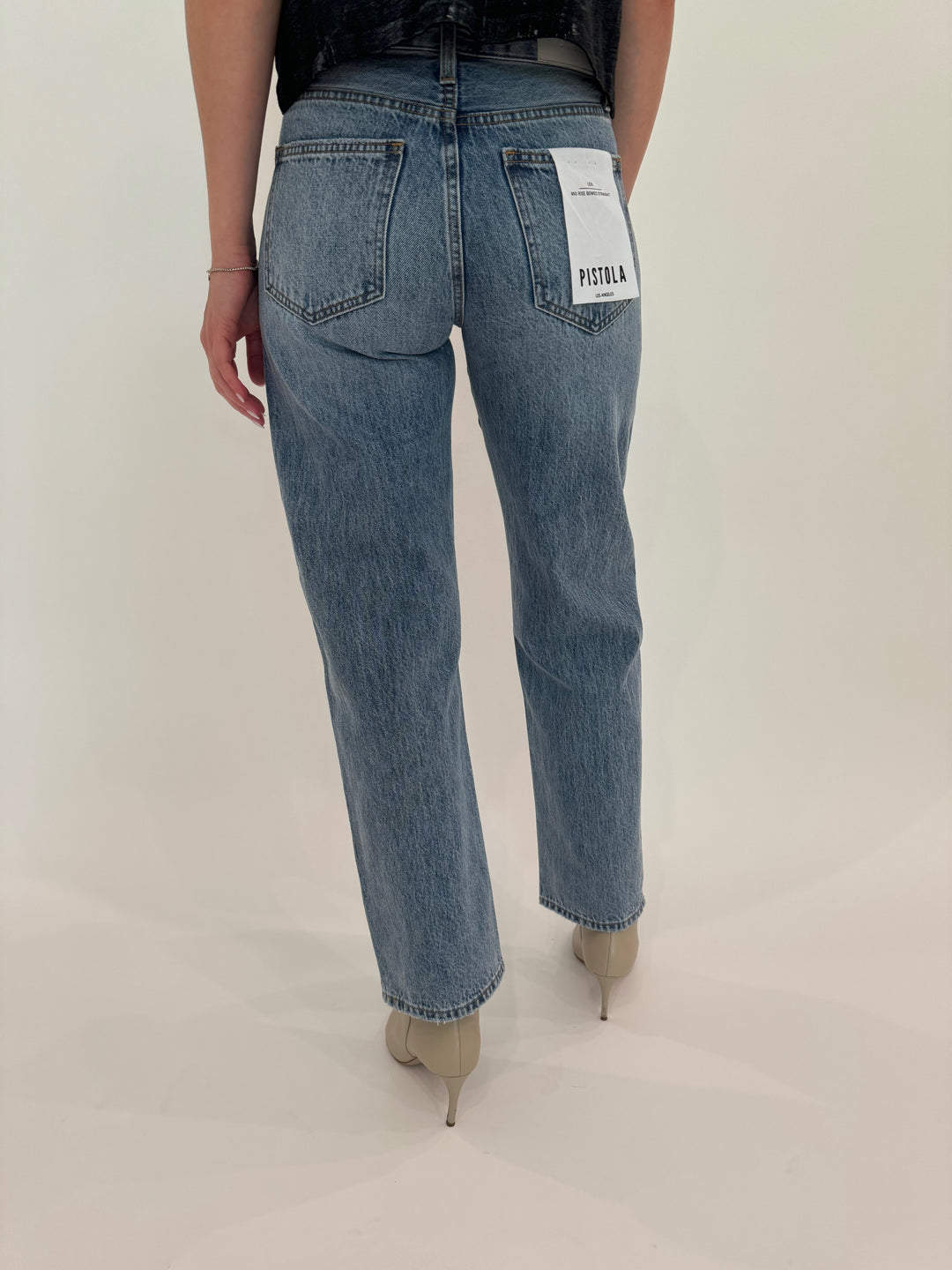 Pistola Lexi Mid Rise Bowed Straight Denim Jeans in Satellite available at Barbara Katz