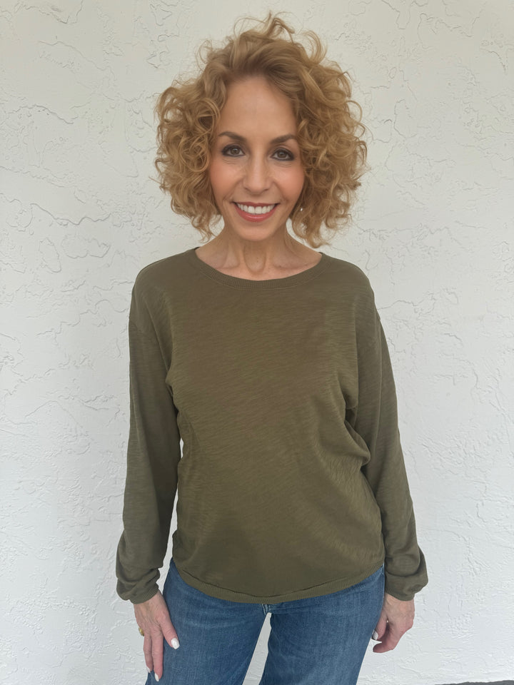 An olive green Elliott Lauren Balloon Sleeve Tee made of 100% cotton, with long sleeves, round neck, and ribbed trims. Perfect for casual wear. #elliottlauren #longsleeves #tee