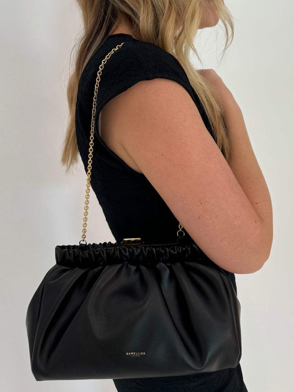 DeMellier Miami Clutch Black Smooth with Gold chain available at Barbara Katz