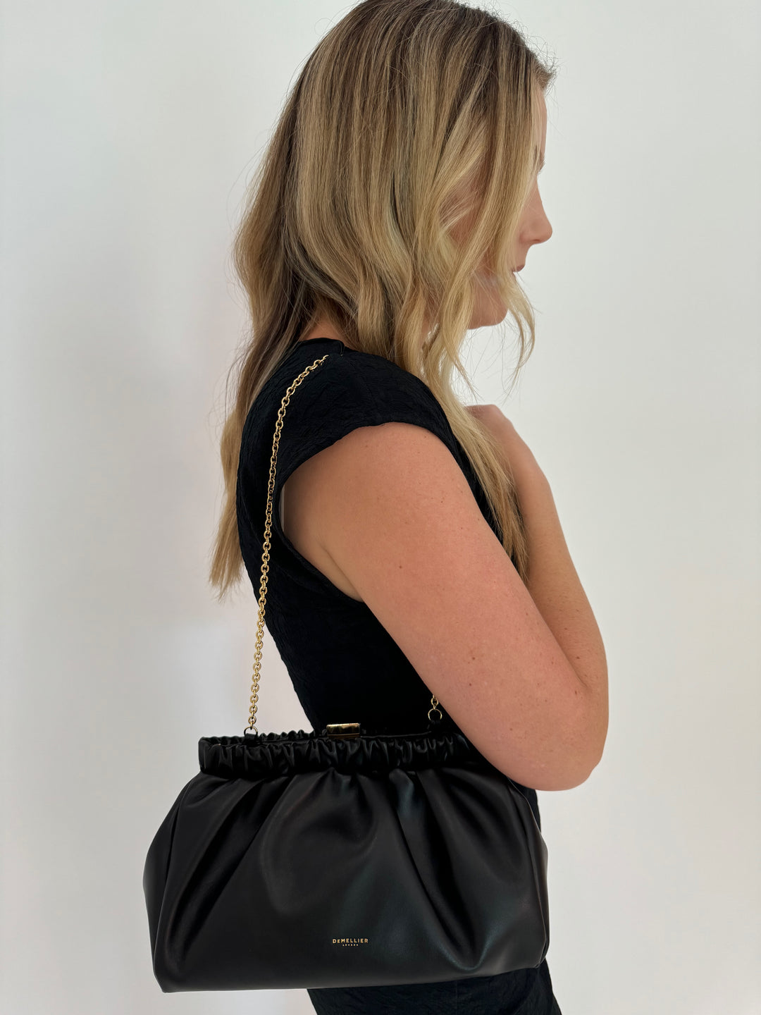 DeMellier Miami Clutch Black Smooth with Gold chain available at Barbara Katz