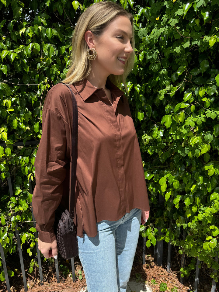 Repeat Blouse With Side End Slits in Brown paired with Frame LeEasy Flare Raw Fray Jeans, and Sol and Selene Divide & Conquer Woven Crossbody Bag in Chocolate