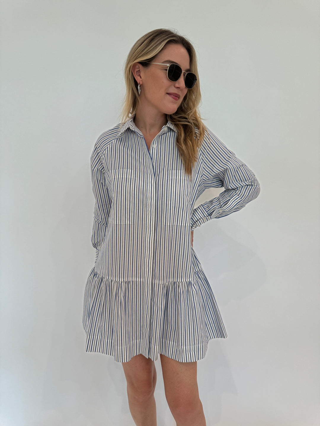 Simkhai Polina Shirt Mini Dress - Cool Gray Stripe with Le Specs Neptune Deux Sunglasses, Alexis Bittar Brut Tube Hoop Earrings in Silver - all available at Barbara Katz