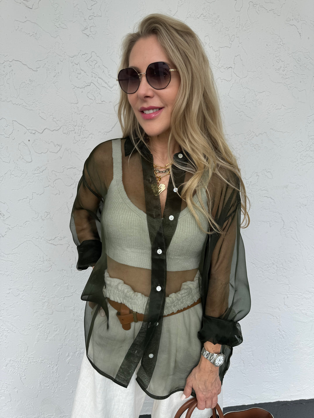 Donni The Silk Organza Shirt in Olive, sheer top featuring a classic collar, mother-of-pearl buttons, long sleeves, dropped shoulders, and relaxed fit