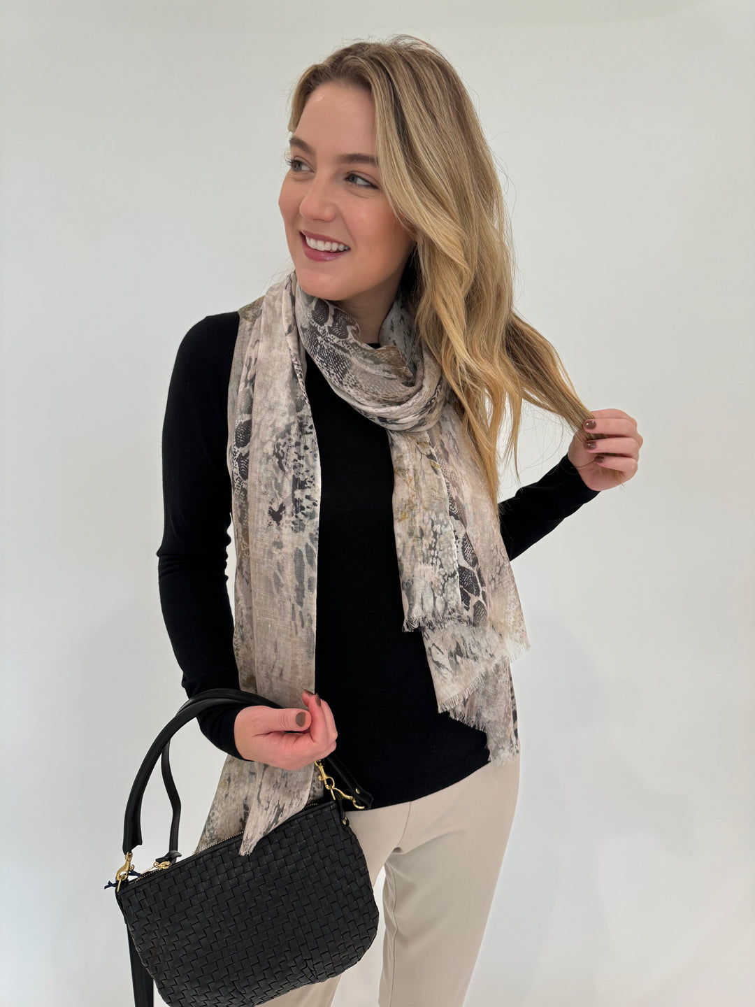 Kinross Cashmere Fitted Crew Sweater in Black paired with Peace of Cloth Annie Pants in Buff, Kinross Python Print Scarf and Clare V Petit Moyen Messenger Bag in Black Woven Checker available at Barbara Katz