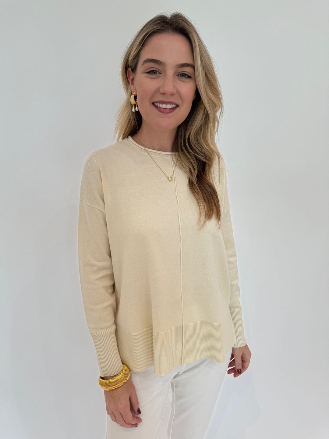 BK Stella Roll Crew Neck Sweater in Ivory with BK Gold Cobra Bracelet, Alexis Bittar Asterales Necklace and Perla Freshwater Pearl Drop Hoops - all available at Barbara Katz