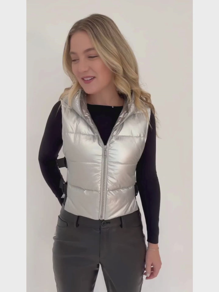 Adroit Atelier Lola Quilted Full Zip Vest in Silver with AMB Black Solid Raw Edge High Neck Second Skin Top underneath, paired with Peace of Cloth Jilian Faux Leather Slim Jeans in Black, all available at Barbara Katz