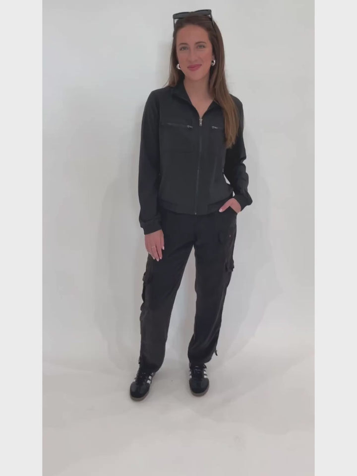 Wearables Active Quinn Bomber Jacket in Black paired with XCVI Sunny Cargo Pants in Black available at Barbara Katz