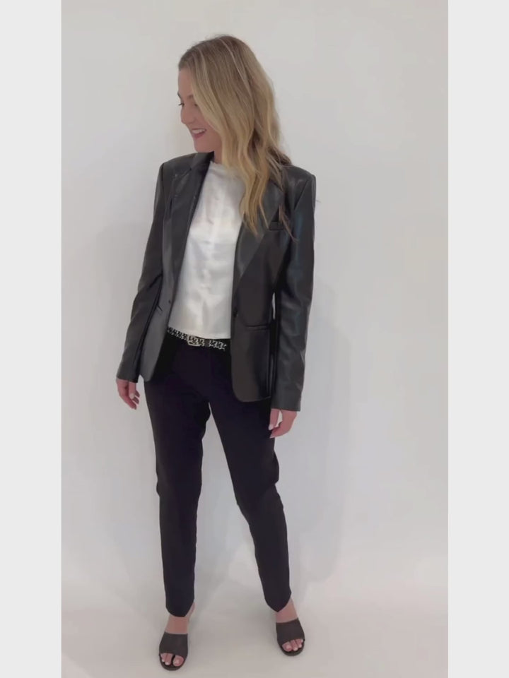 Melissa Nepton Off White Tenesi Satin Top layered with Generation Love's Zella Vegan Leather Blazer in Black available at Barbara Katz