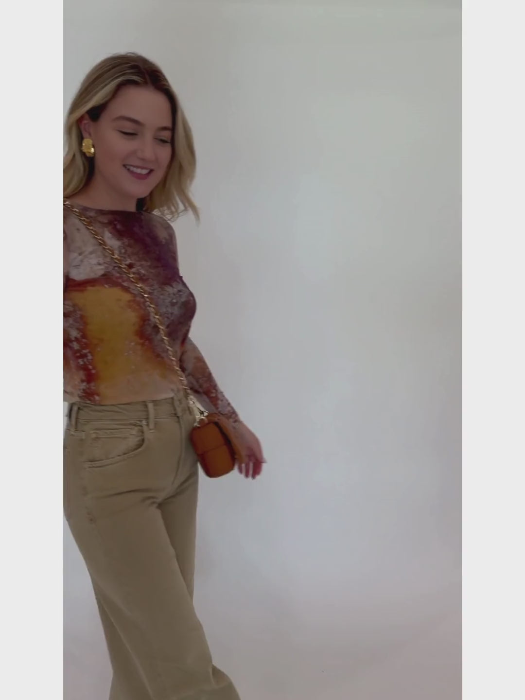 AMB Florence Double Sheer Top in Cavely paired with Citizens of Humanity Lyra Crop Wide Leg Jeans in Porcini, and BK Square Weave Leather Crossbody Bag in Camel, all available at Barbara Katz