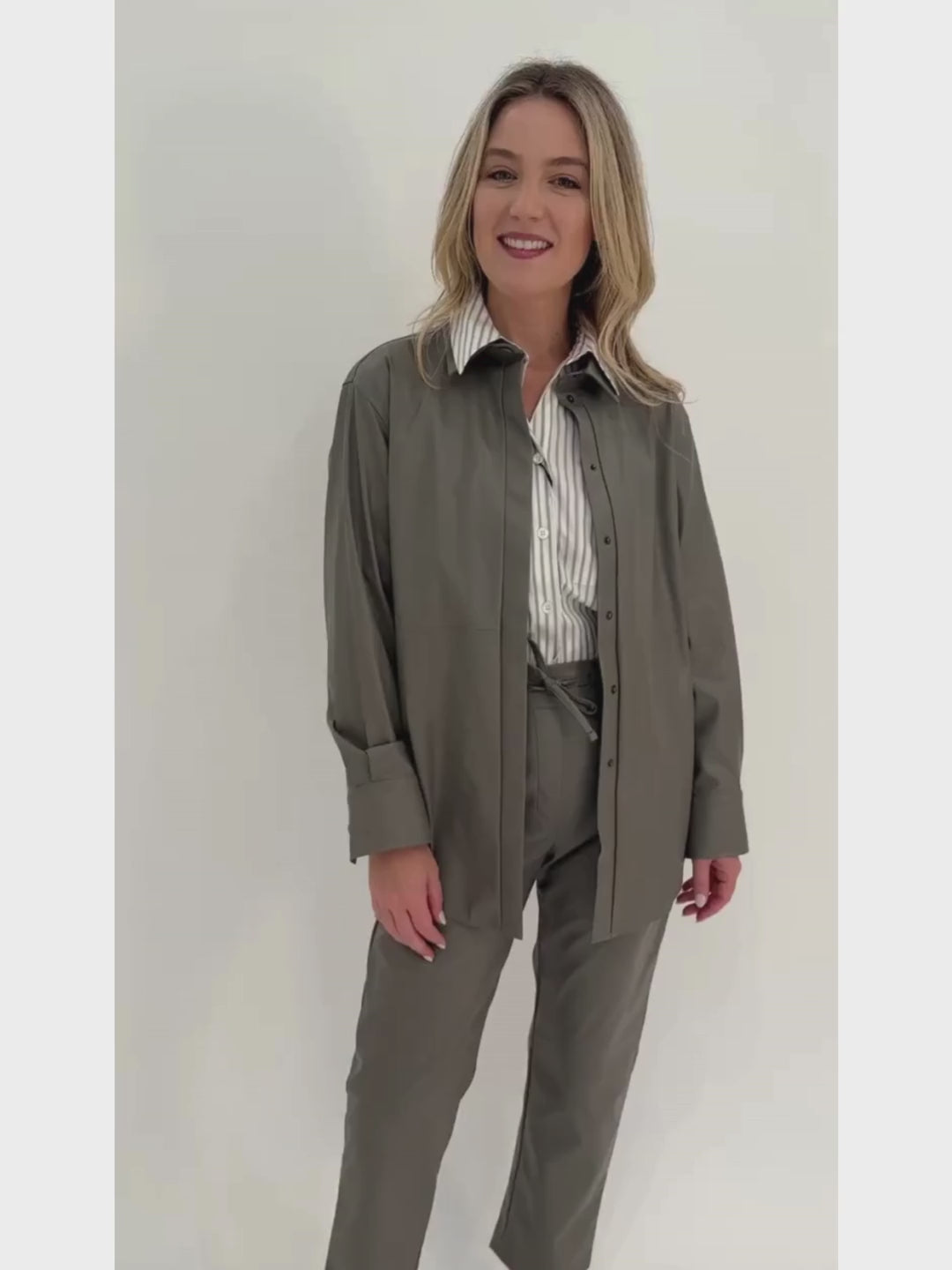 Marella Viterbo Cropped Shirt in Grey layered with Volto Jersey Jacket and paired with Selva Jersey Trousers, all available at Barbara Katz